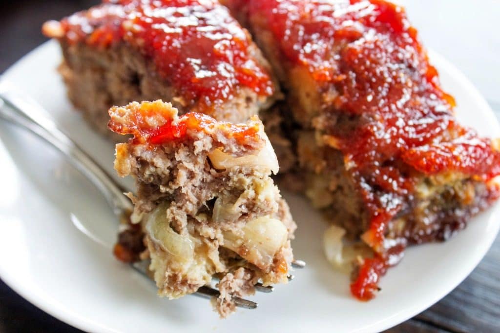 BROWN SUGAR MEATLOAF - Covered with a sweet brown sugar glaze this meatloaf full of flavor, it's the best meatloaf you will ever have. Grab a fork & dig in. a forkful of meatloaf.
