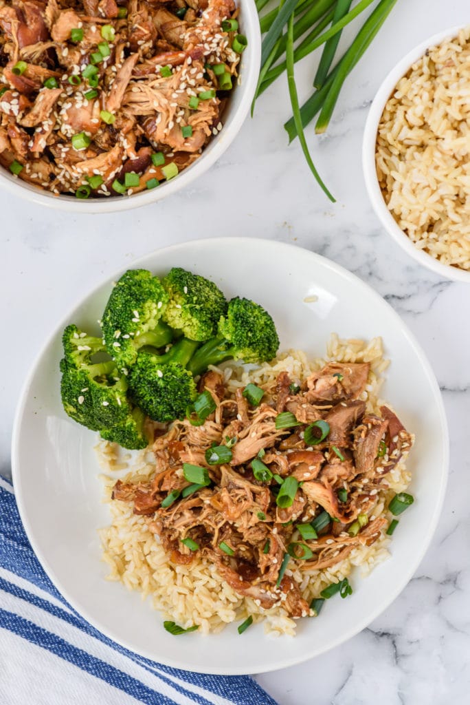 overhead photo of the honey garlic chicken on a plate with rice and broccoli
