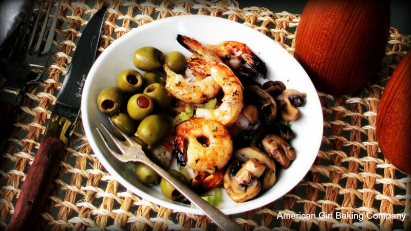 Piquant Grilled Shrimp with Chimichurri Seasoning served in a bowl with grilled mushrooms and green olives