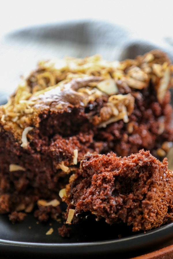 chocolate almond coffee cake with fork and plate with a bite