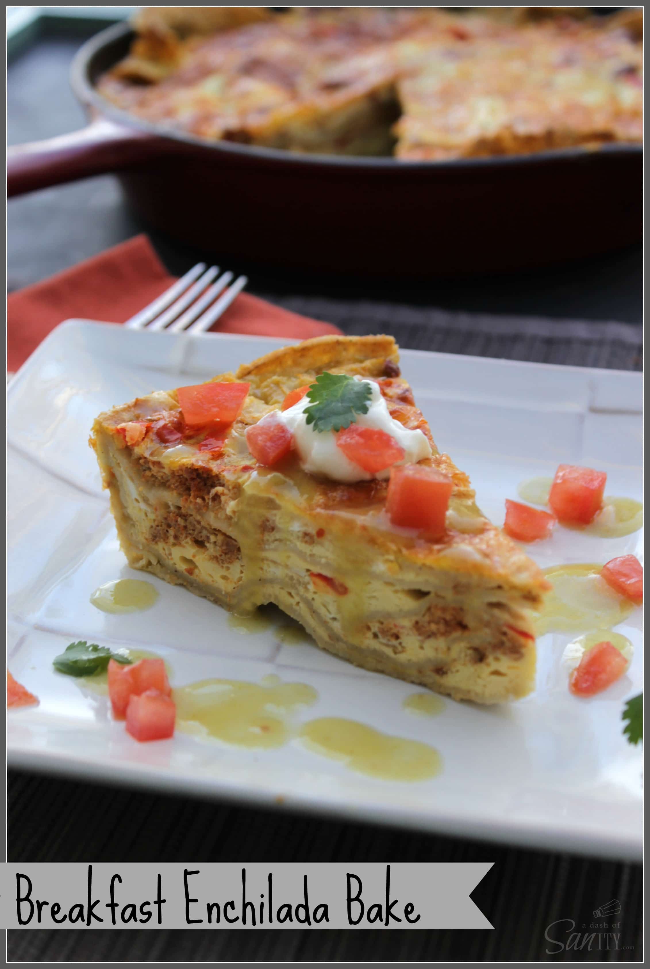 Breakfast Enchilada Bake slice served on a square plate, with cast iron skillet in background