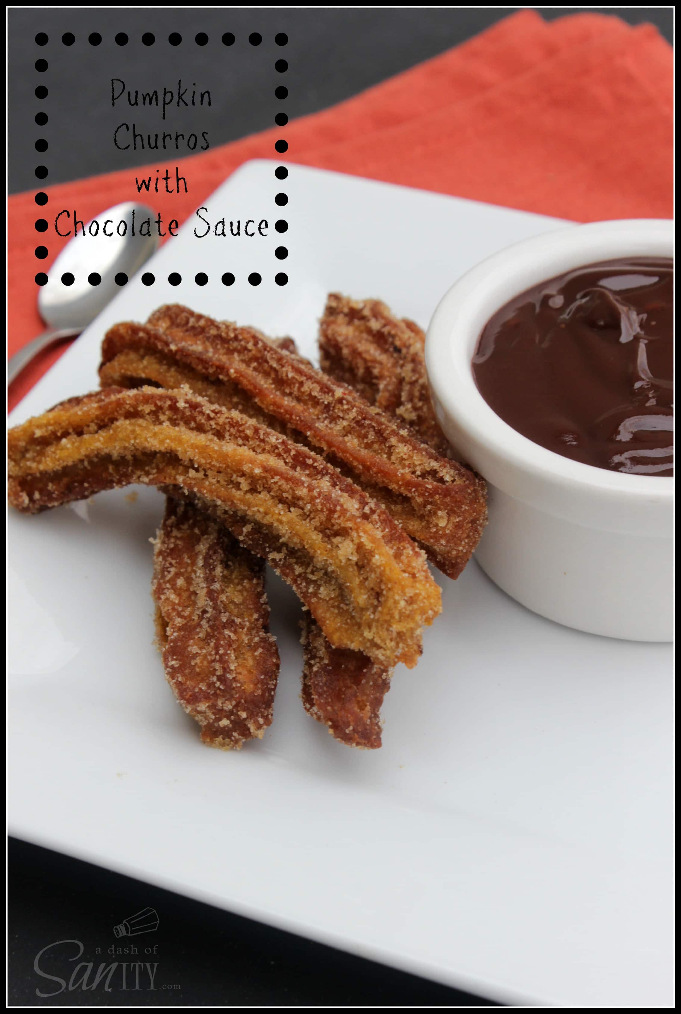 Pumpkin Churros on a plate with Chocolate Dipping Sauce in a small dipping cup
