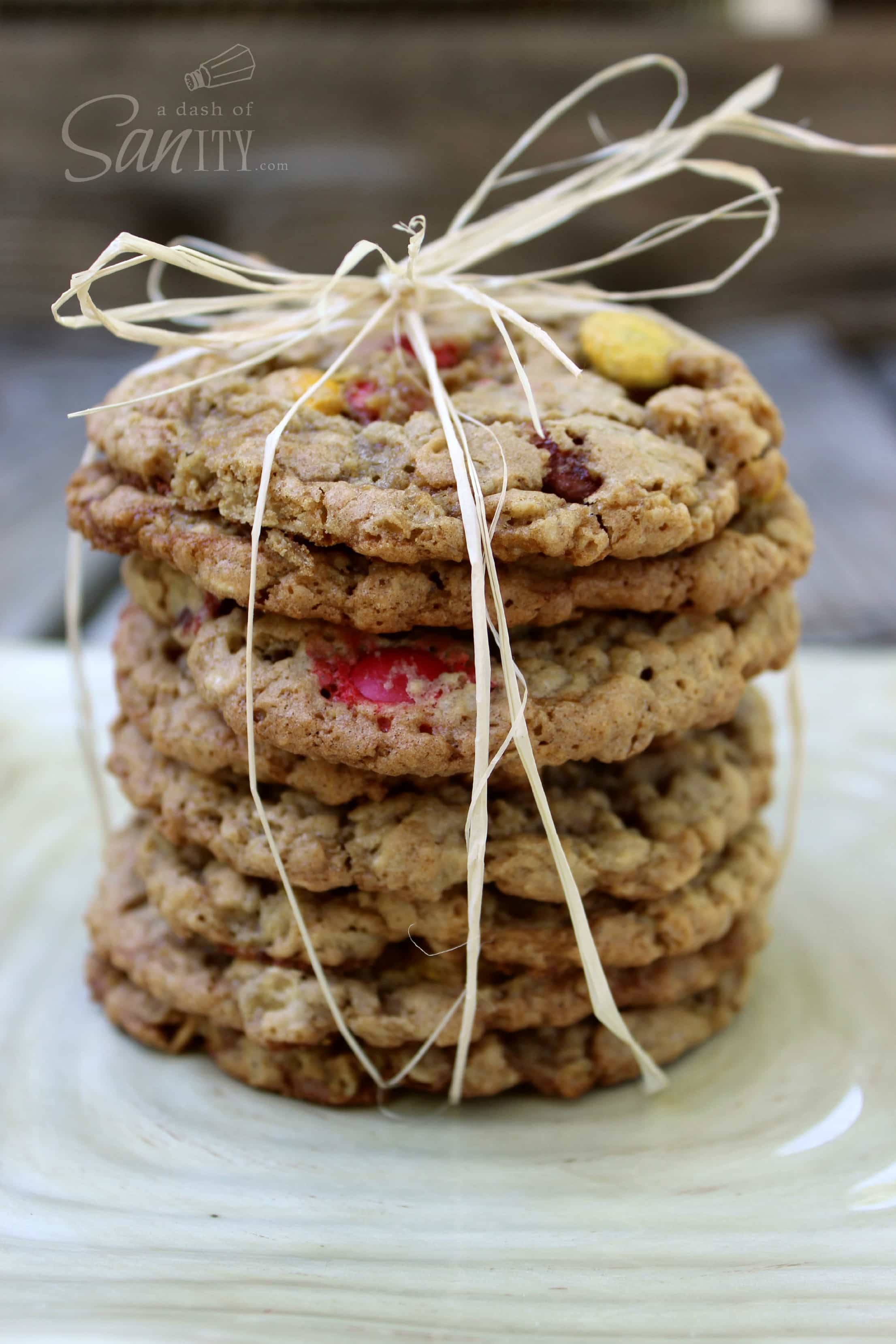 These Monster Cookies and "Monster" Teacher Treats are soft, chewy cookies, perfect for a back-to-school teacher treat. They are utterly irresistible! Monster Cookies in a stack with a straw bow holding them together