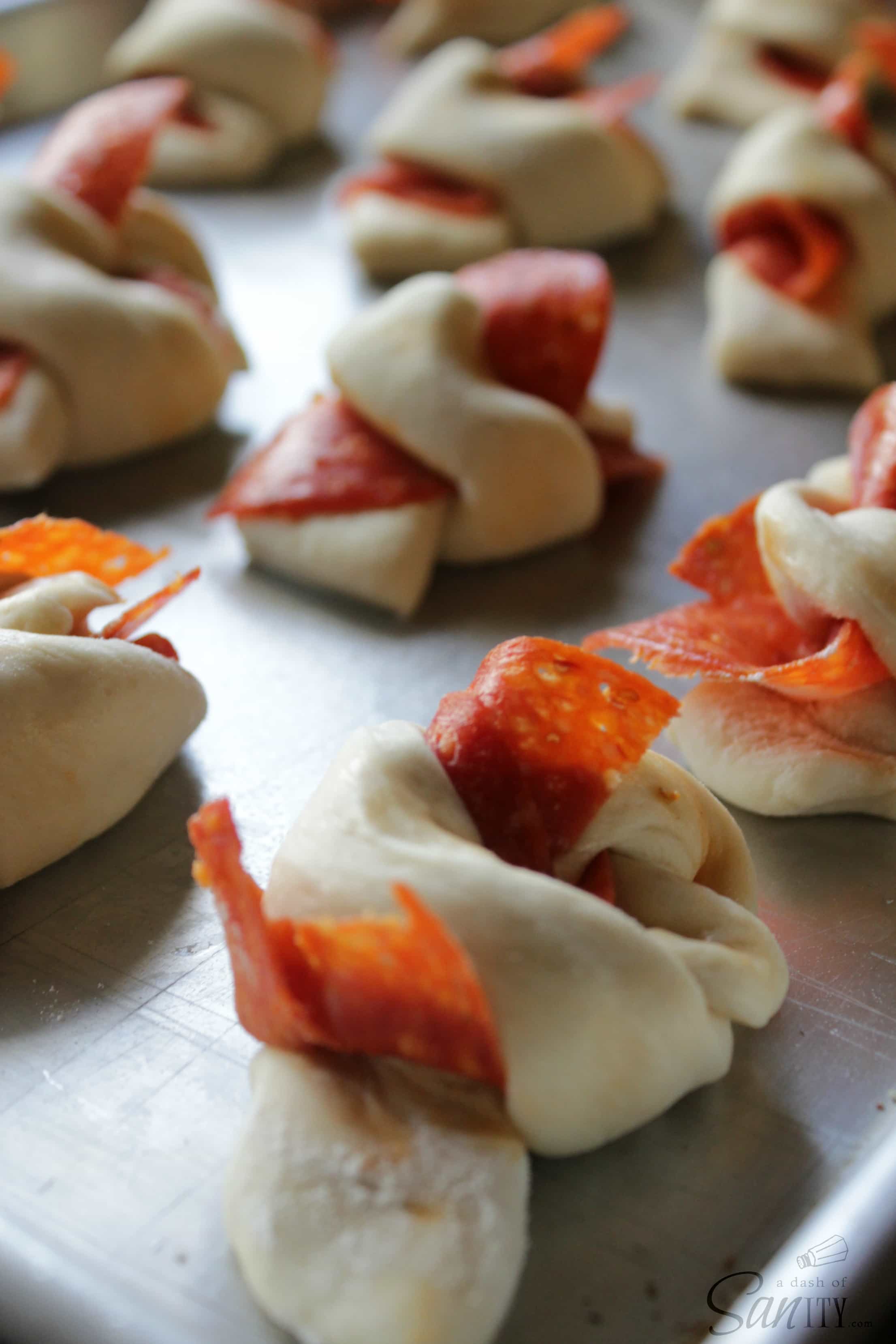 uncooked Pepperoni Garlic Knots on baking sheet