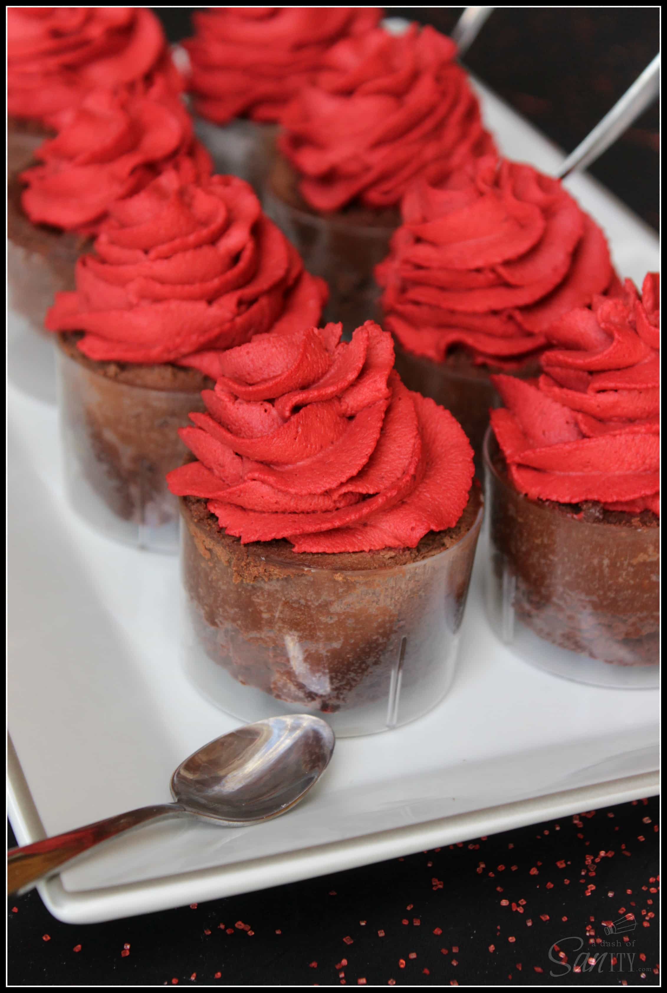 Decadent Chocolate Flourless Cake with Red Velvet Mousse in clear mousse cups on a rectangle serving tray