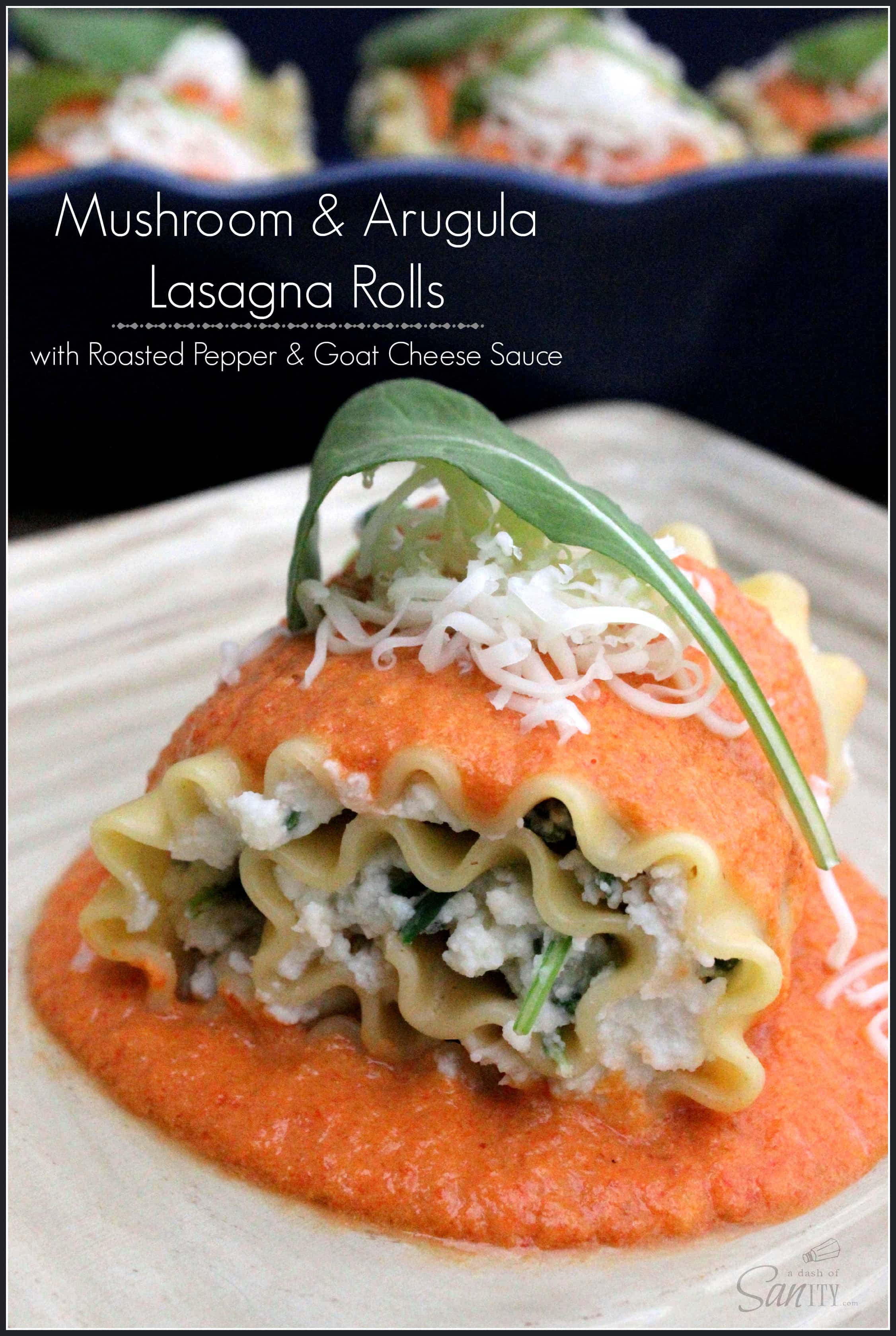 Mushroom & Arugula Lasagna Rolls with Roasted Pepper & Goat Cheese Sauce on a plate topped with parmesan and a basil leaf