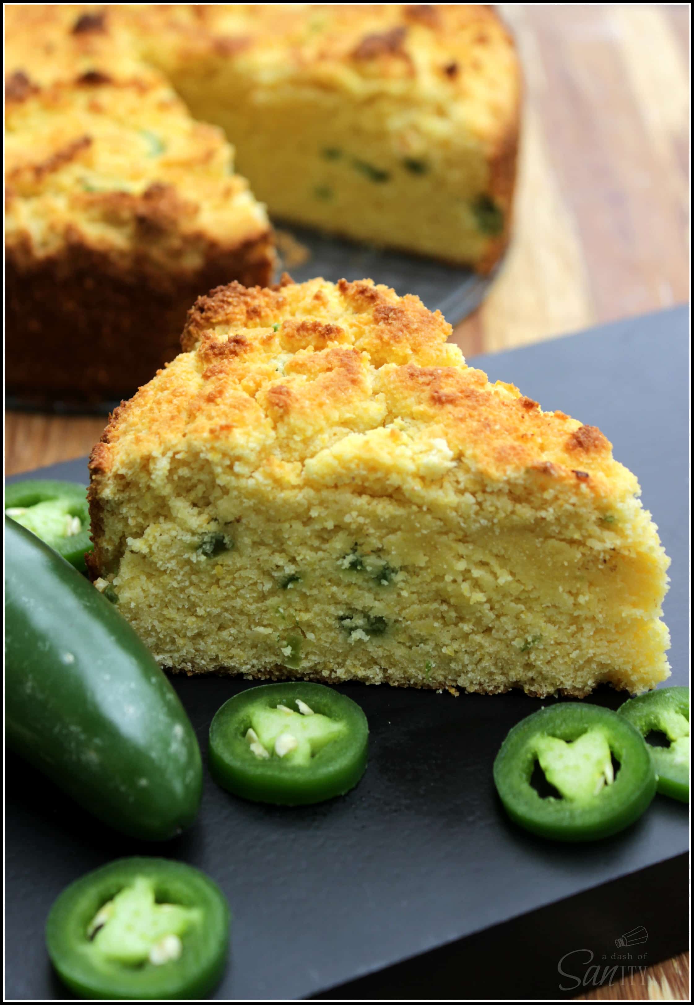 Gluten-Free Sweet Jalapeño Cornbread made with coconut flour and fresh jalapeno is a sweet bread with a hint of spice that everyone will enjoy. slice of cornbread with jalapenos
