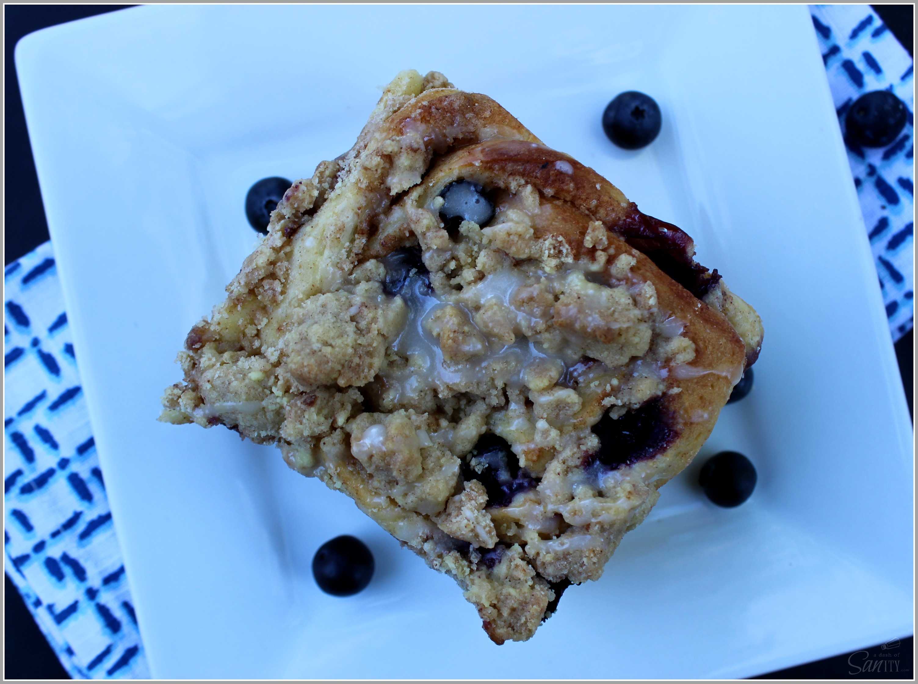 Blueberry Crumb Sweet Rolls with fresh blueberries & a creamy cinnamon center, then topped with a crumb topping, marrying two morning favorites.