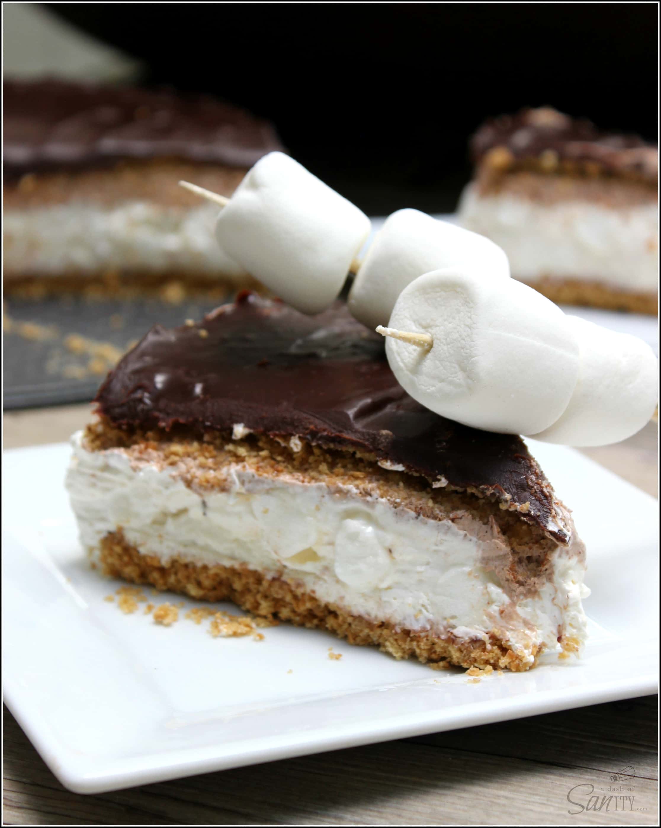 slice of no bake smores cheesecake with marshmallow on top