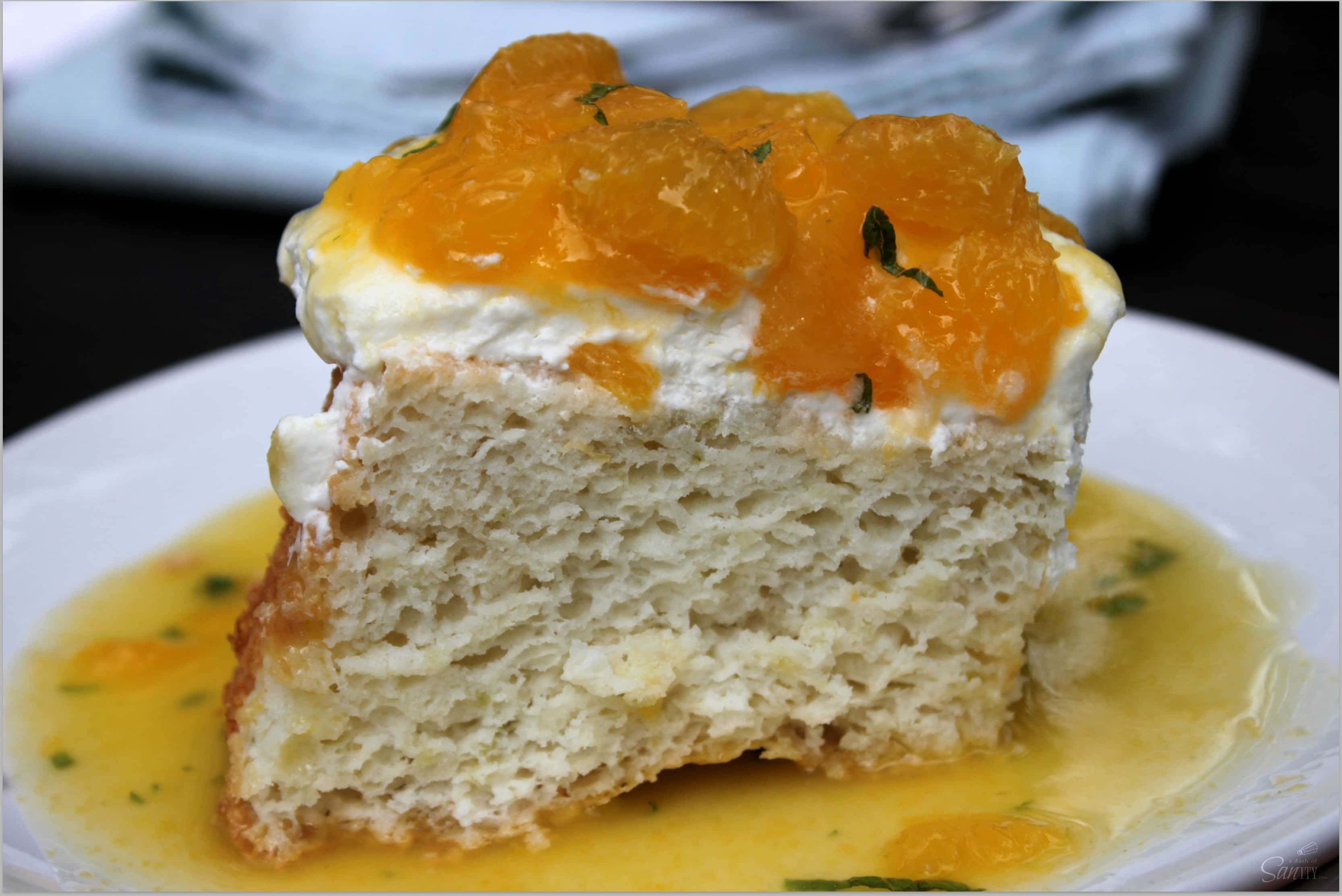 Citrus Angel Food Cake Topped with Fresh Oranges and Mint is a classic cake made with non-traditional twist. It is the perfect mix of sweet and tangy. Citrus Angel Food Cake Topped with Fresh Oranges and Mint is a classic cake made with non-traditional twist. It is the perfect mix of sweet and tangy.