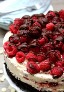 white chocolate raspberry no bake cheesecake with ganache
