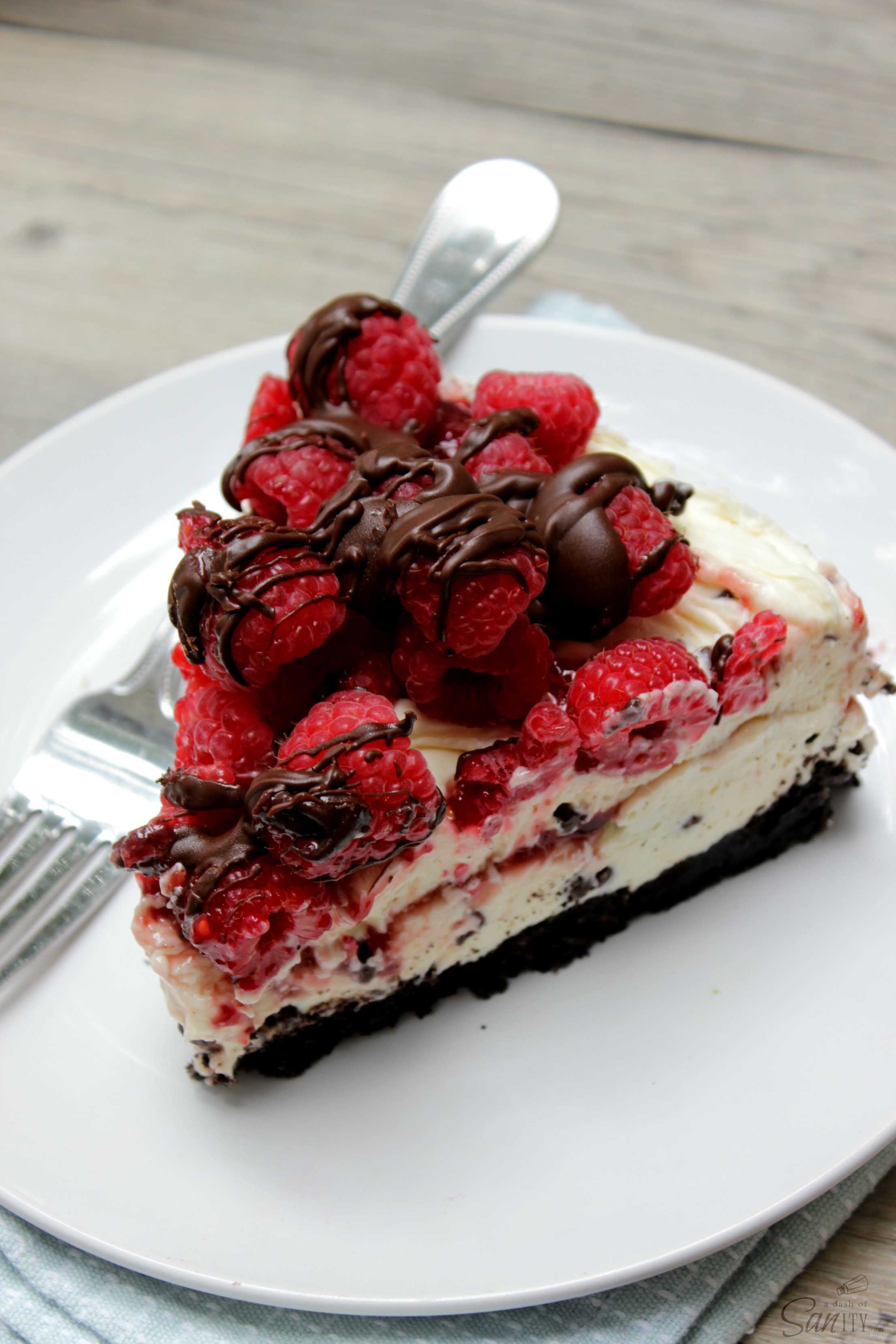 White Chocolate Raspberry Truffle No Bake Cheesecake laced with raspberry preserves & truffle chunks. Easy, delicious dessert you can prepare in 30 minutes. White Chocolate Raspberry Truffle No Bake Cheesecake laced with raspberry preserves & truffle chunks. Easy, delicious dessert you can prepare in 30 minutes.