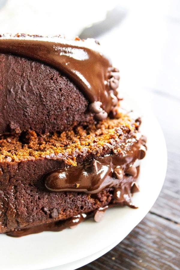 2 slices of chocolate pumpkin cake on their sides on a white plate