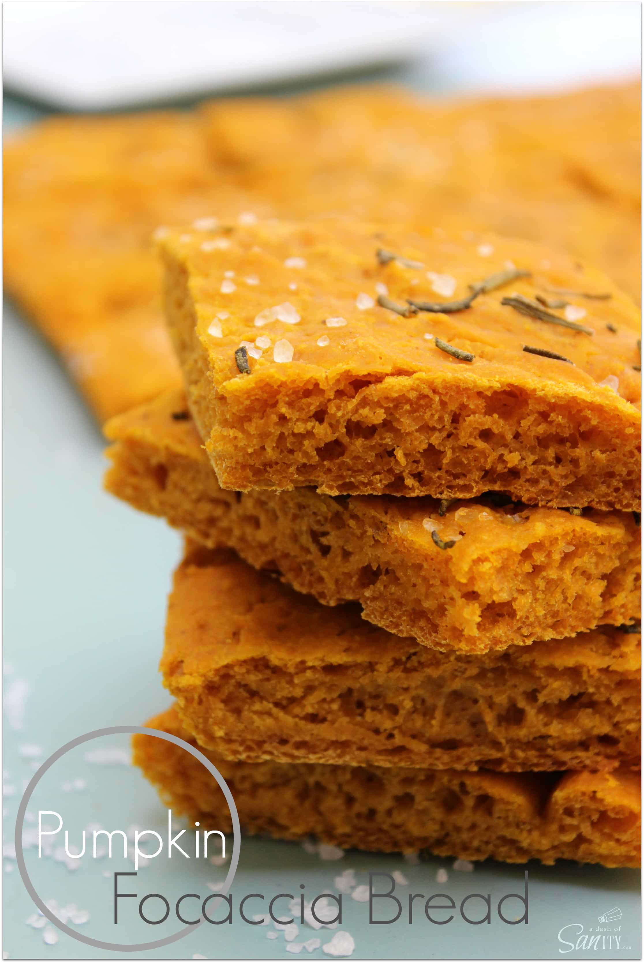 This Pumpkin Focaccia Bread is a savory fall inspired bread made with fresh pumpkin and rosemary. It is an easy to make addition to your holiday spread. Pumpkin Focaccia Bread