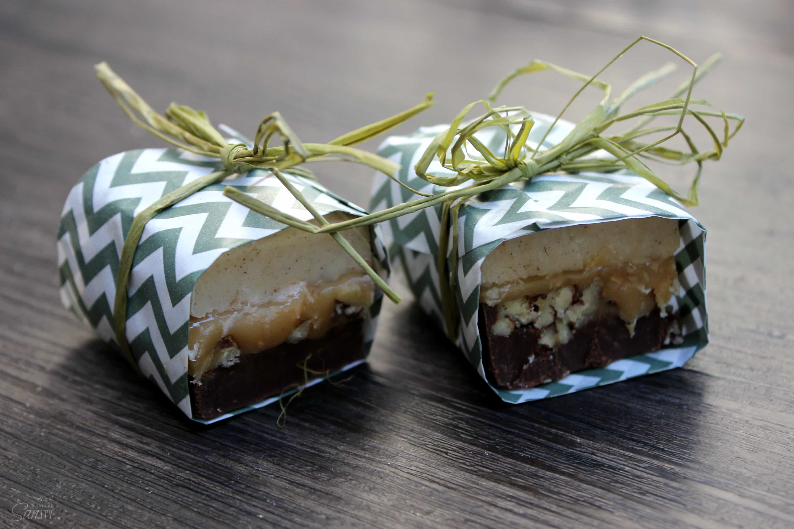 Pumpkin Spice Turtle Fudge is made with layers of chocolate, caramel, and pecans. This traditional fudge recipe just got a new fall twist.