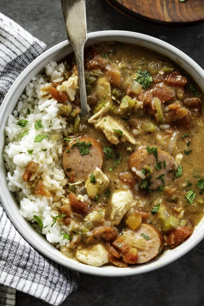 overhead shot of gumbo in bowl with rice