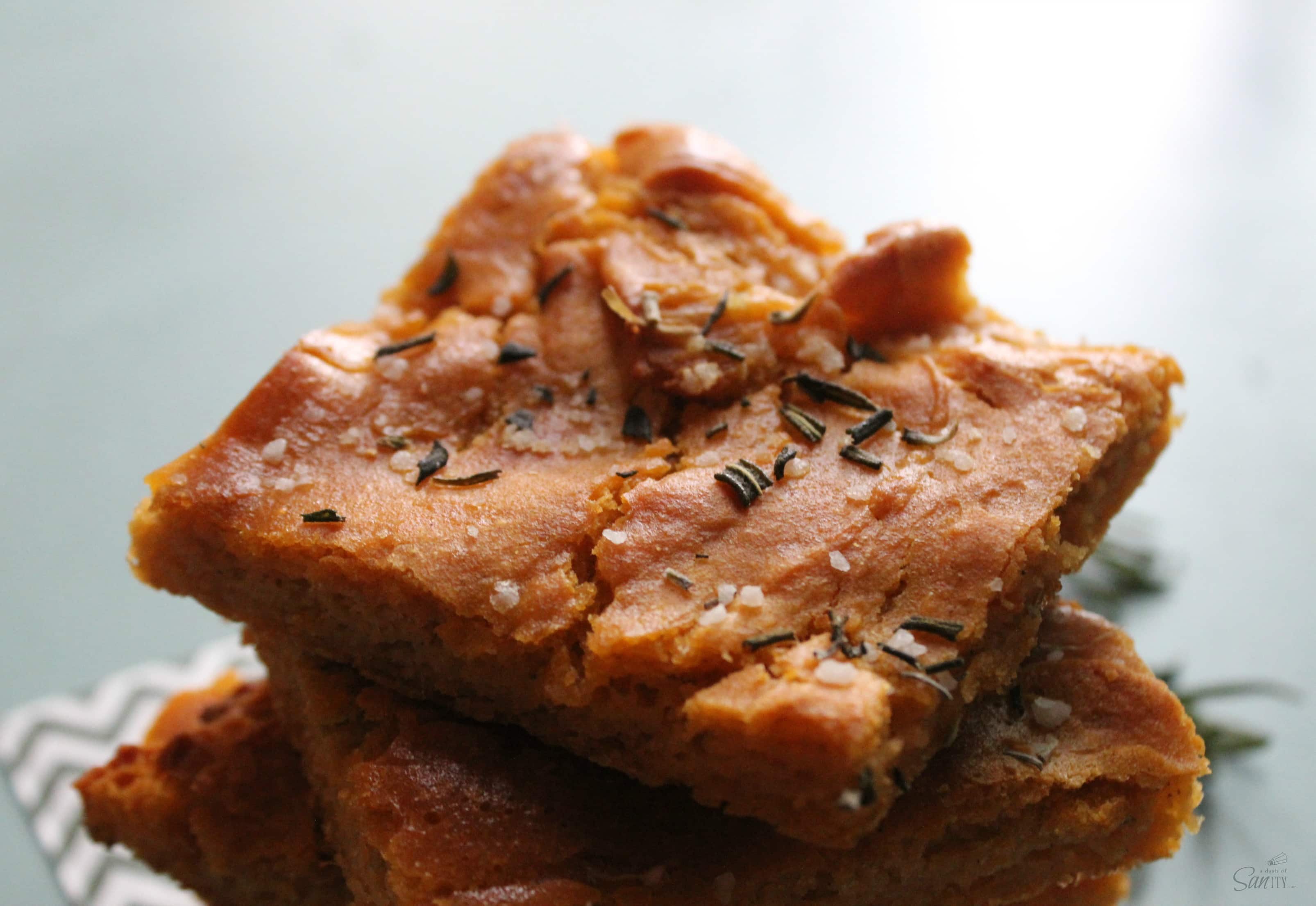 This Gluten Free Sweet Potato Focaccia Bread is a savory bread topped with sea salt and fresh rosemary. It is a perfect addition to any fall dinner.