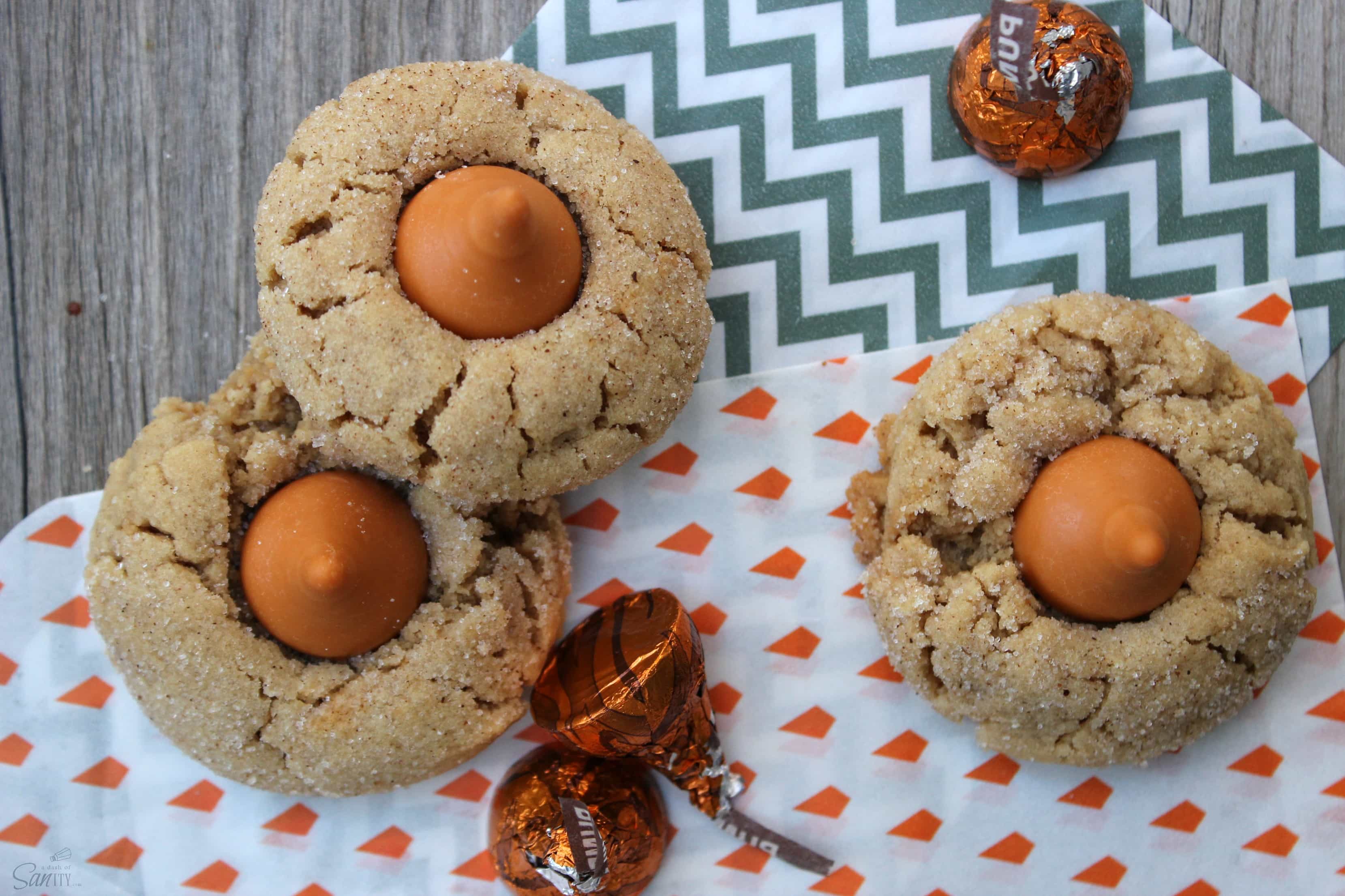 These Pumpkin Spice Peanut Butter Blossoms are a pumpkin-spice peanut butter cookie topped with a Pumpkin Spice Hershey Kiss. They are a perfect fall treat. These Pumpkin Spice Peanut Butter Blossoms are a pumpkin-spice peanut butter cookie topped with a Pumpkin Spice Hershey Kiss. They are a perfect fall treat.