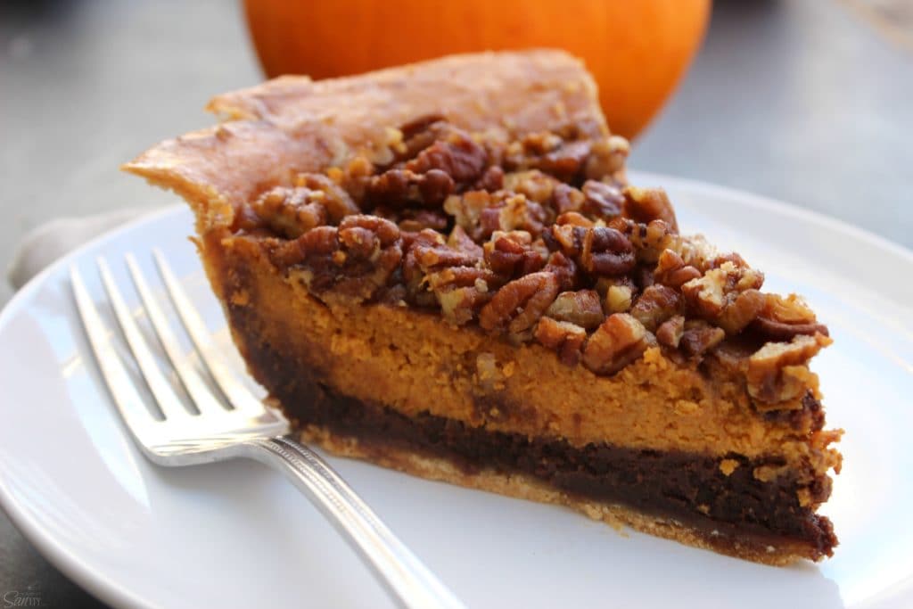Chocolate Pecan Pumpkin Pie rich chocolate "brownie like" bottom, classic pumpkin pie and topped with pecans all baked into one delicious pie.