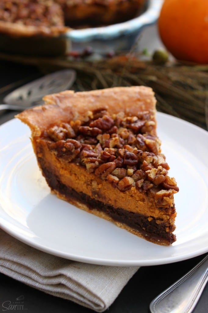 Chocolate Pecan Pumpkin Pie rich chocolate "brownie like" bottom, classic pumpkin pie and topped with pecans all baked into one delicious pie.