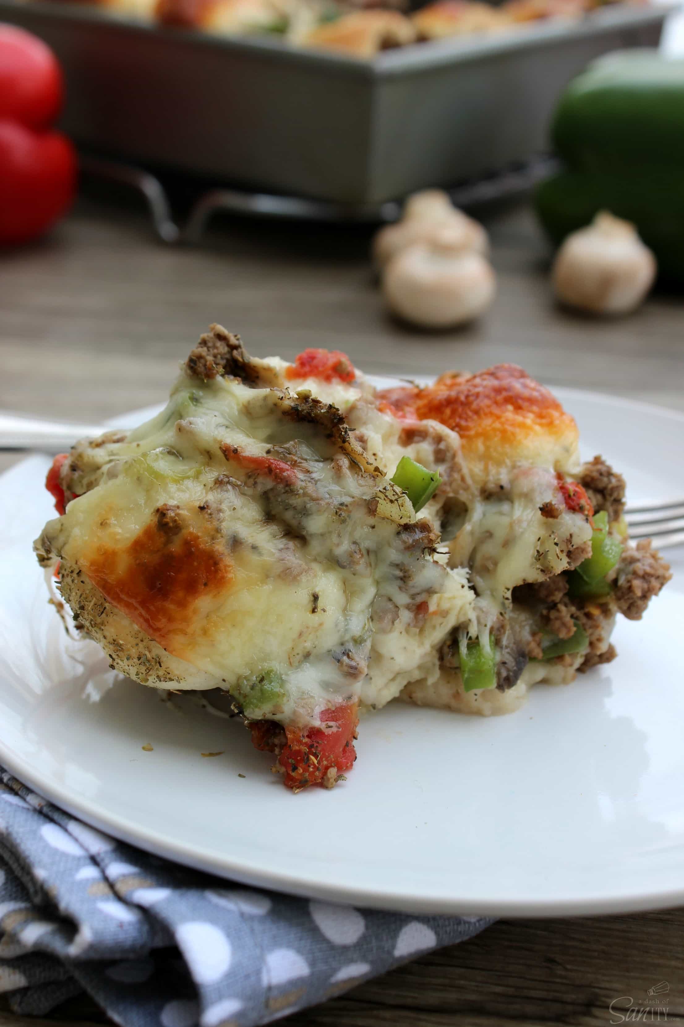 These Cheesy Pull Apart Italian Subs are so easy and delicious! Made with all the delicious toppings that are found in a traditional Italian Sub. 