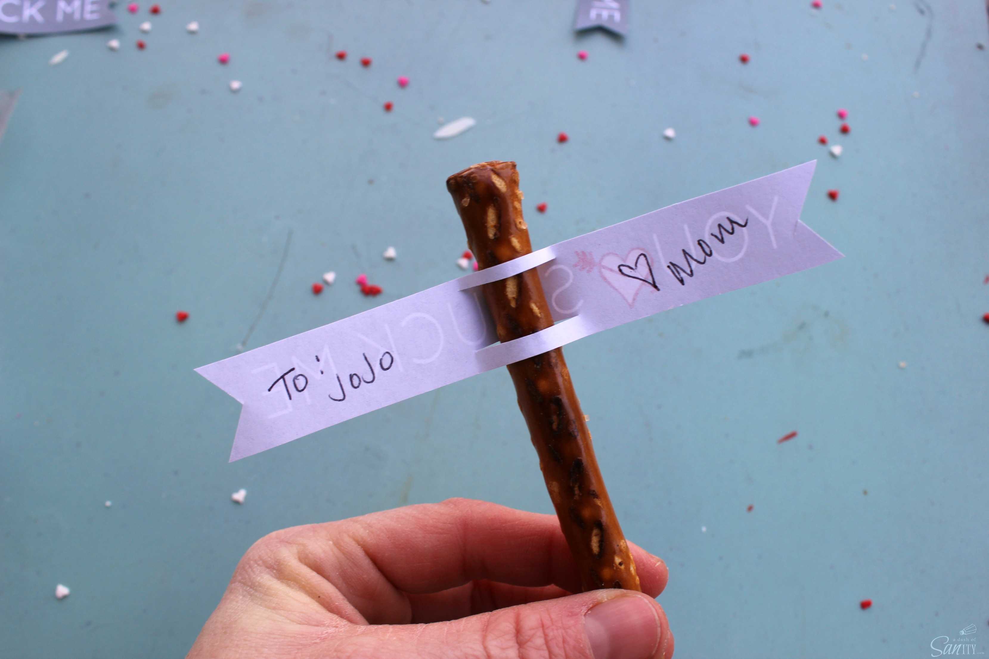 Cupid’s Arrow Pretzel Rods are a fun and festive Valentine’s Day treat. Using Vanilla CandiQuik and conversation candy hearts, these are easy to prepare. Cupid’s Arrow Pretzel Rods are a fun and festive Valentine’s Day treat. Using Vanilla CandiQuik and conversation candy hearts, these are easy to prepare.