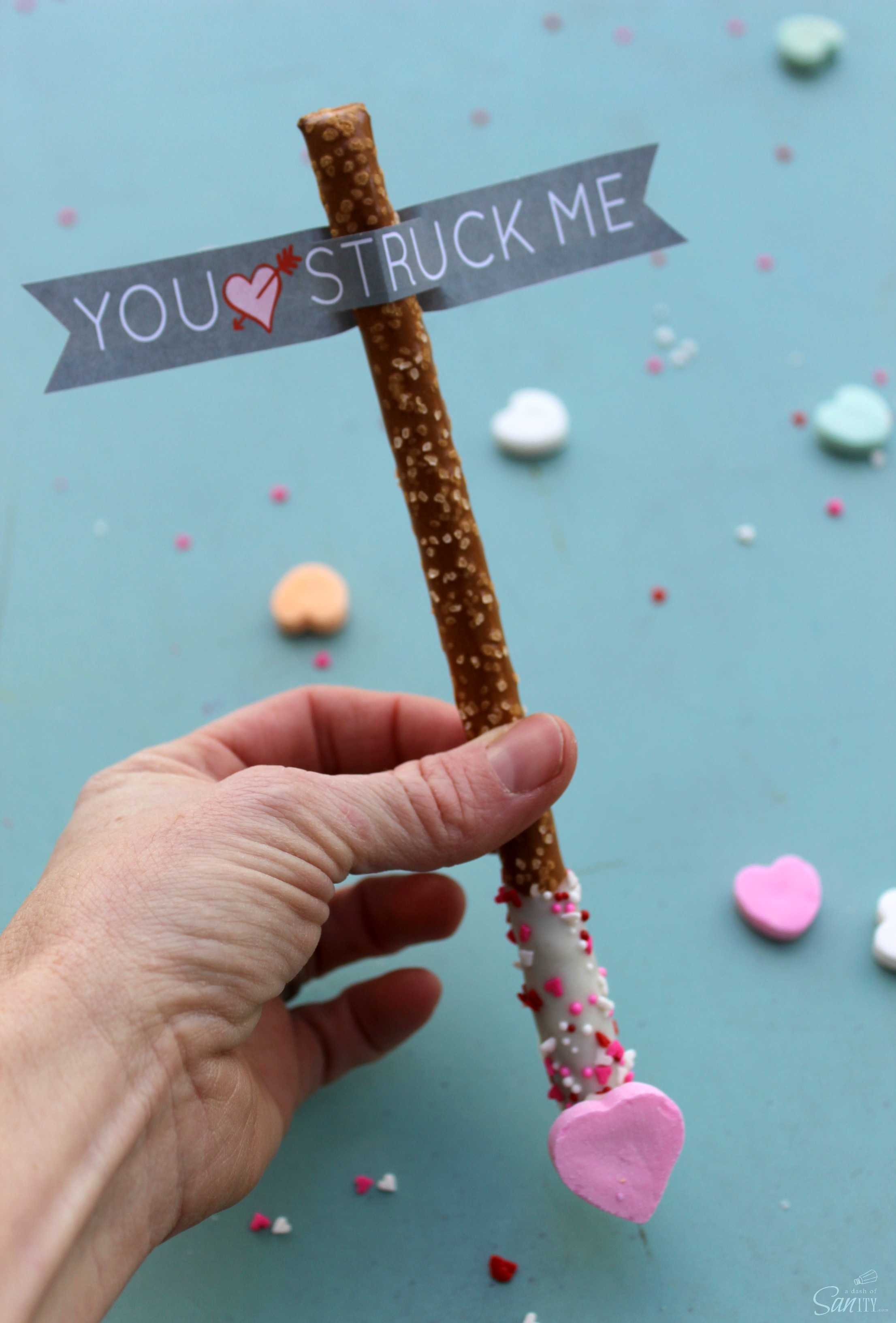 Cupid’s Arrow Pretzel Rods are a fun and festive Valentine’s Day treat. Using Vanilla CandiQuik and conversation candy hearts, these are easy to prepare. Cupid’s Arrow Pretzel Rods are a fun and festive Valentine’s Day treat. Using Vanilla CandiQuik and conversation candy hearts, these are easy to prepare.