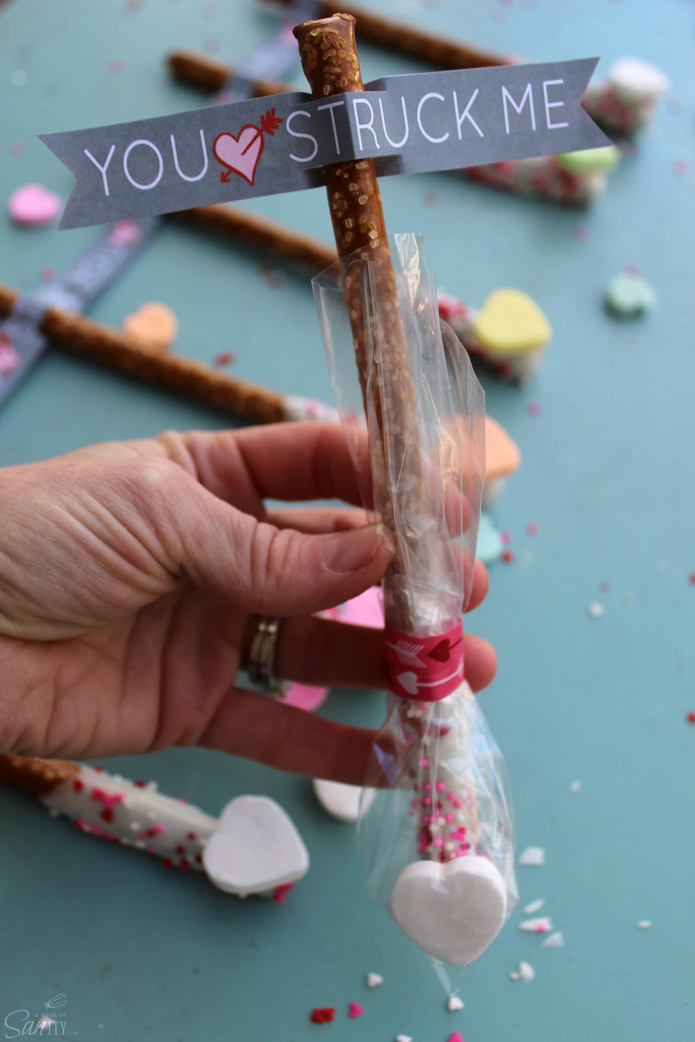 Cupid’s Arrow Pretzel Rods are a fun and festive Valentine’s Day treat. Using Vanilla CandiQuik and conversation candy hearts, these are easy to prepare. Cupid’s Arrow Pretzel Rods are a fun and festive Valentine’s Day treat. Using Vanilla CandiQuik and conversation candy hearts, these are easy to prepare.