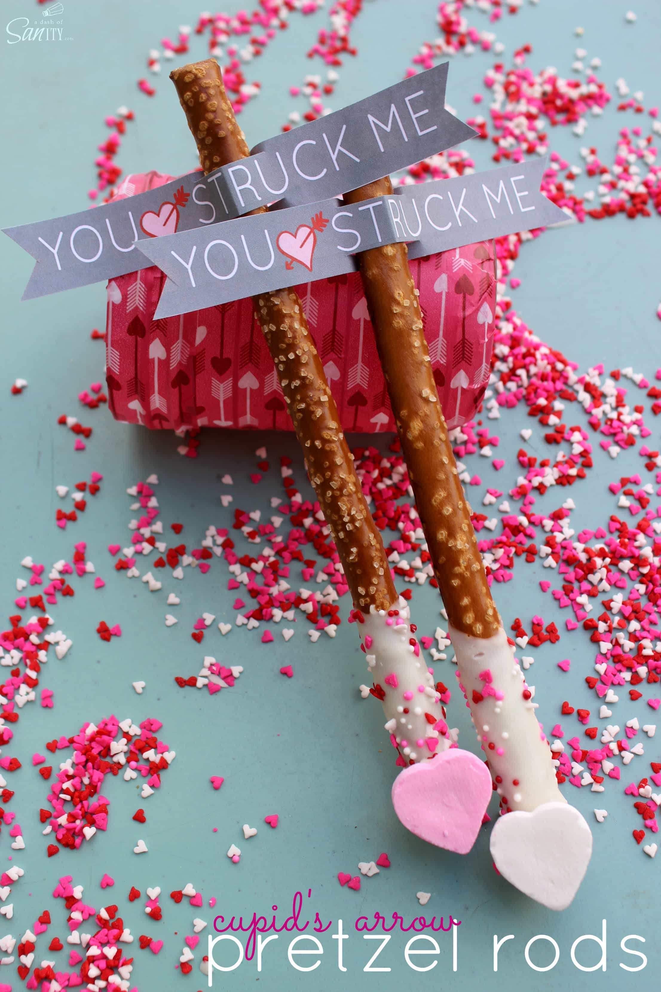 Cupid’s Arrow Pretzel Rods are a fun and festive Valentine’s Day treat. Using Vanilla CandiQuik and conversation candy hearts, these are easy to prepare. Cupid’s Arrow Pretzel Rods are a fun and festive Valentine’s Day treat. Using Vanilla CandiQuik and conversation candy hearts, these are easy to prepare.