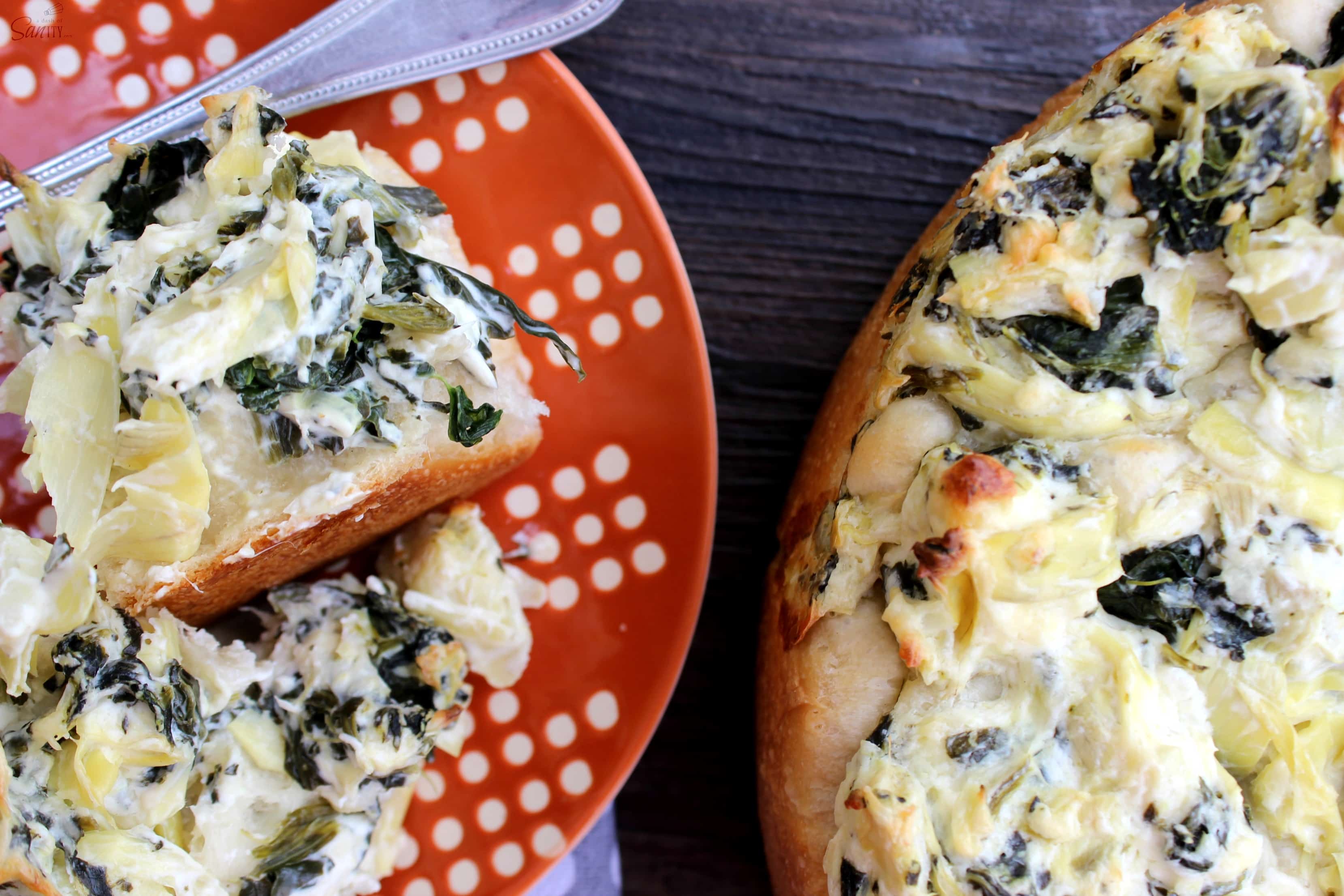 Florentine Artichoke Pull Aparts are a twist on classic Florentine Artichoke Dip. Serve this creamy dip baked on top of rolls making delightful pull-aparts.