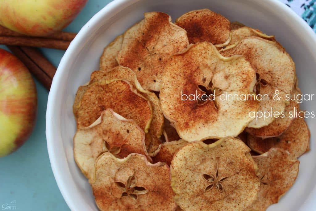BAKED CINNAMON SUGAR APPLE SLICES are a perfect snack. Crispy baked apples slices coated in cinnamon and sugar like a fruit chew but better! Baked Cinnamon Sugar Apple Slices in white bowl
