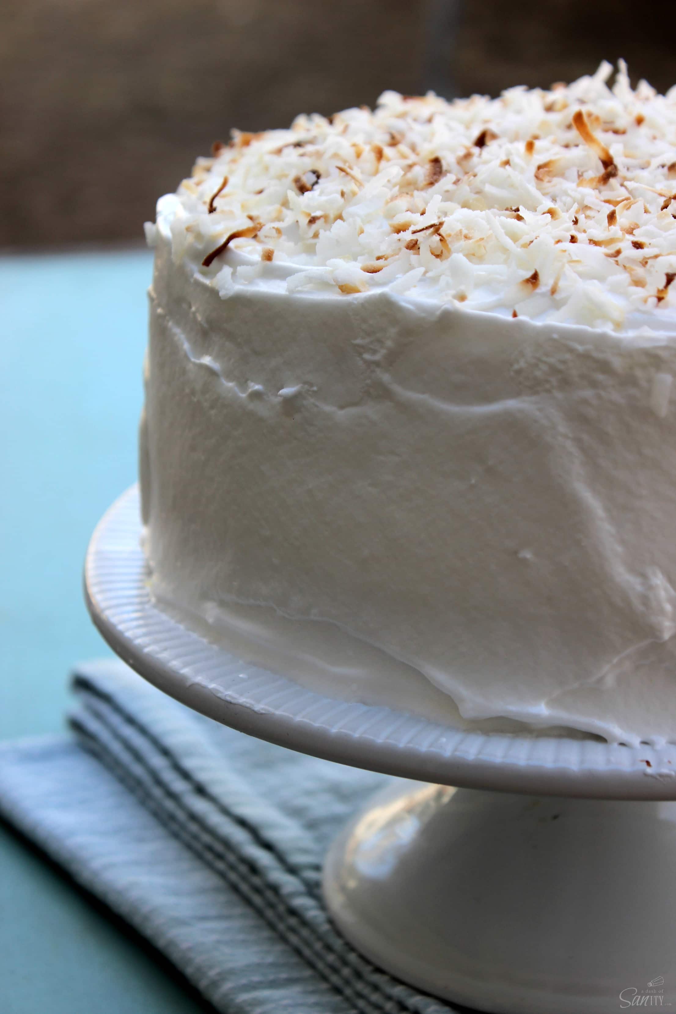 This Double Coconut Cake is a two layer, light coconut cake, that is filled and frosted with coconut meringue frosting and sweetened flaked coconut.