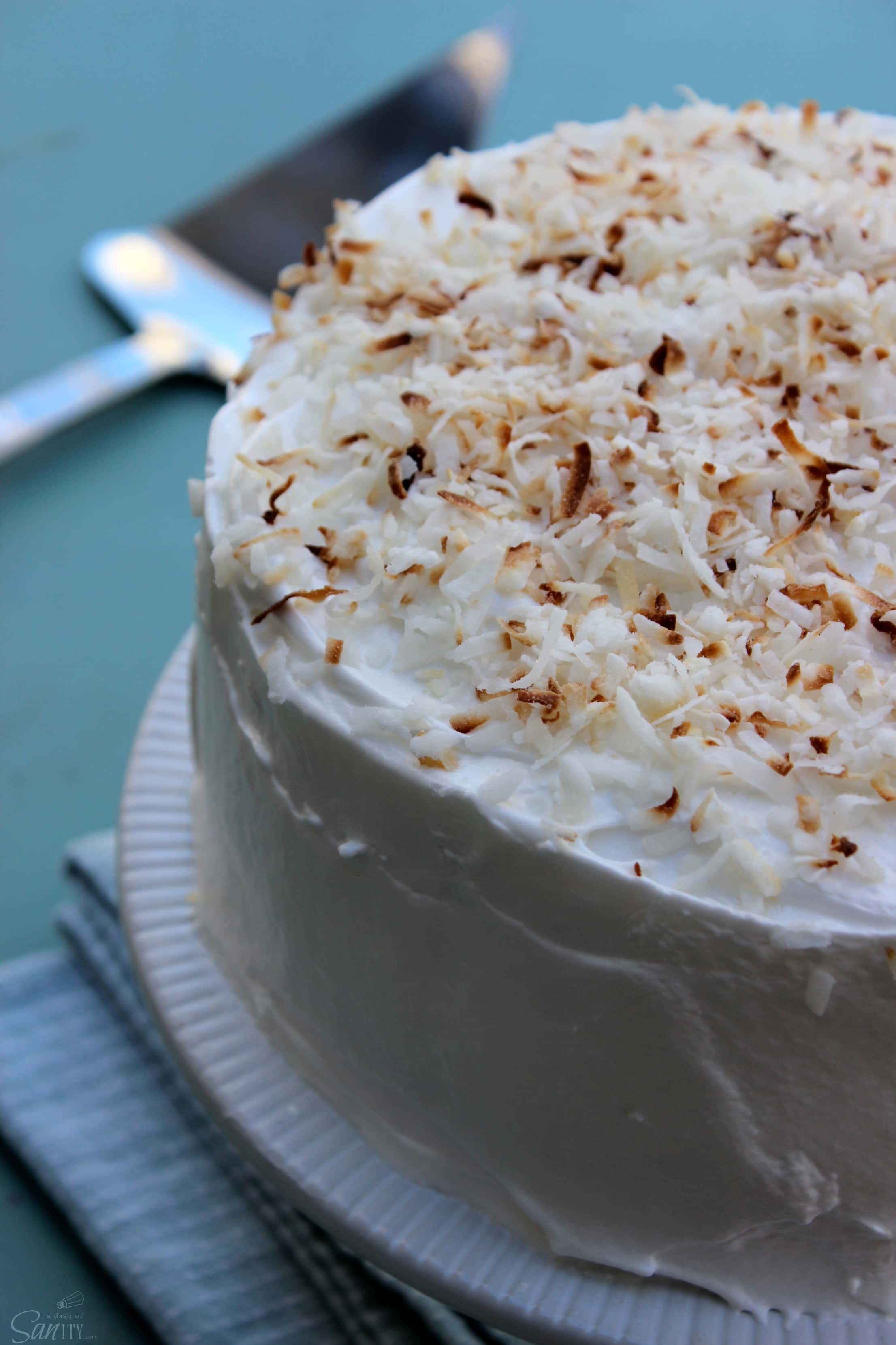 This Double Coconut Cake is a two layer, light coconut cake, that is filled and frosted with coconut meringue frosting and sweetened flaked coconut.