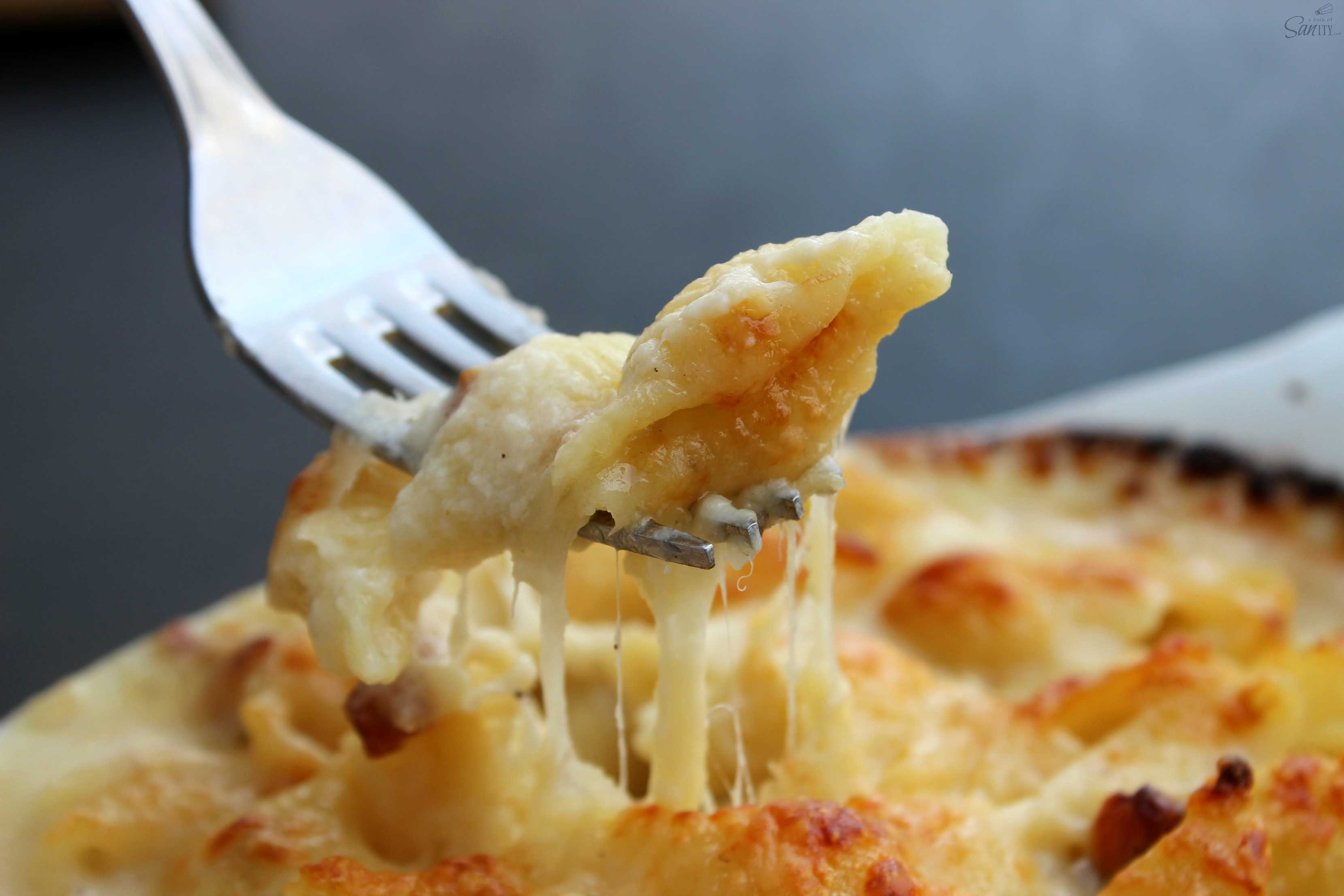 Scalloped Mac & Cheese is a creamy, rich, and delish pasta dish that is easy to make & ready in less than 45-minutes. Time to move over Scalloped Potatoes.