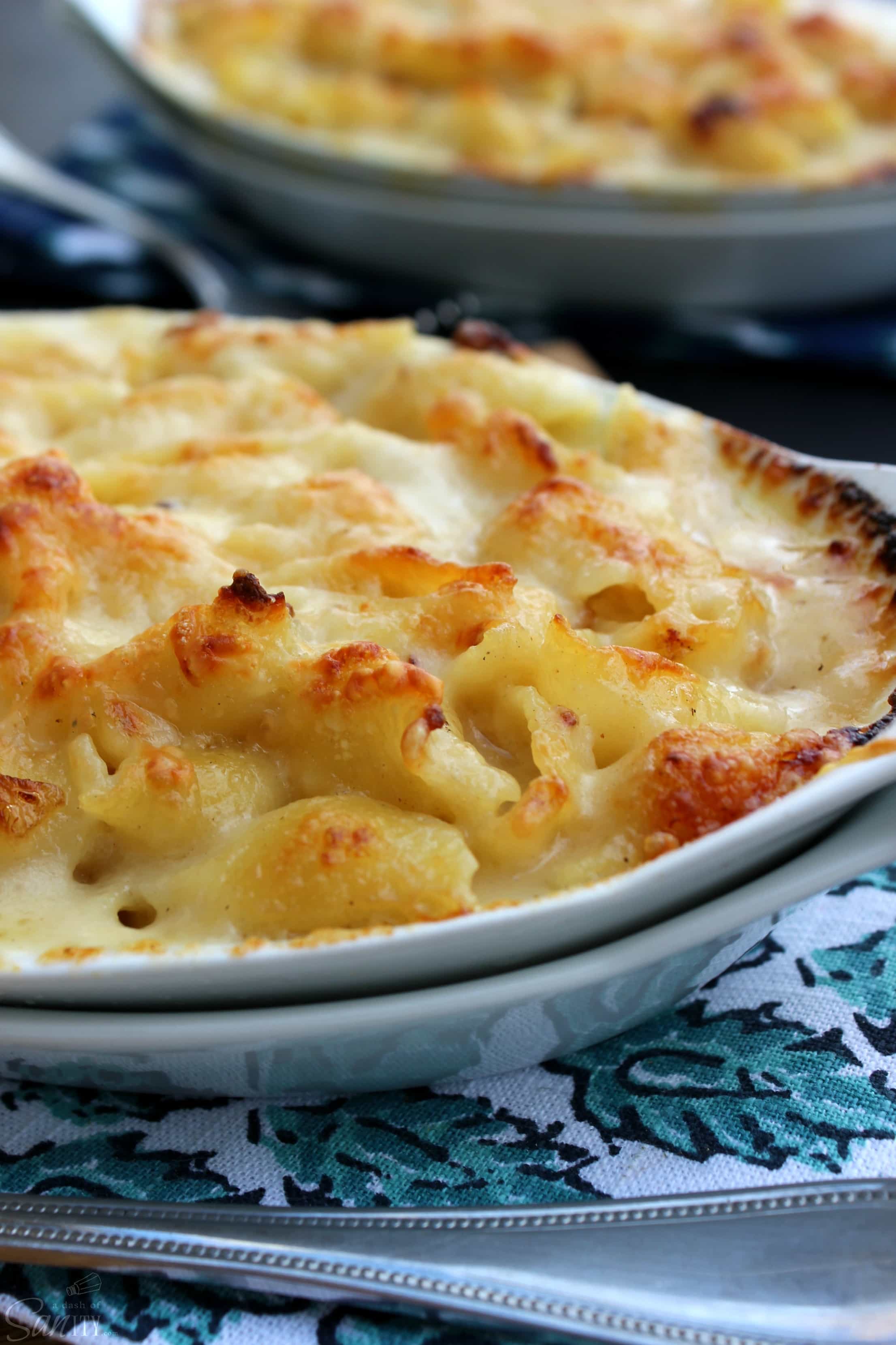 Scalloped Mac & Cheese is a creamy, rich, and delish pasta dish that is easy to make & ready in less than 45-minutes. Time to move over Scalloped Potatoes.