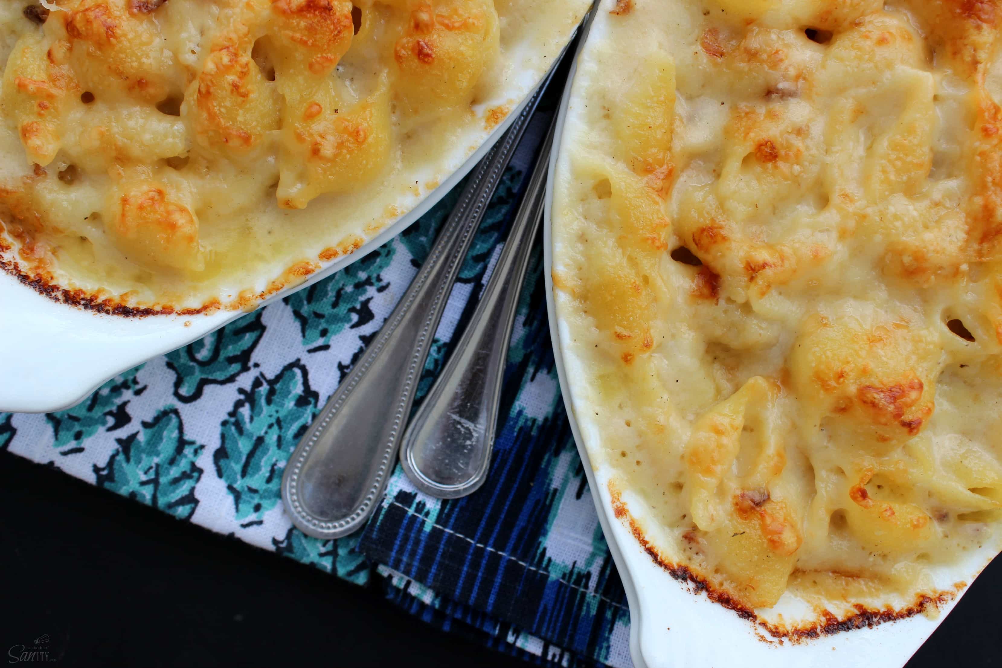 Scalloped Mac & Cheese is a creamy, rich, and delish pasta dish that is easy to make & ready in less than 45-minutes. Time to move over Scalloped Potatoes.