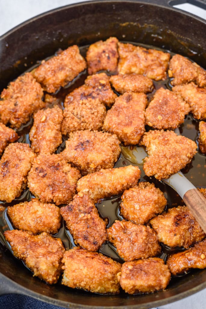 photo of the baked chicken in a skillet with the sauce