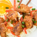 photo of a plate of orange chicken