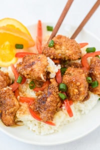 photo of a plate of orange chicken