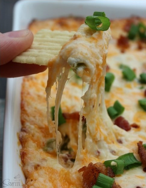 Creamy Bacon Jalapeno Dip takes all of the ingredients from our favorite jalapeno poppers and combines them into a creamy, cheesy, and easy to prepare dip. Creamy Bacon Jalapeno Dip with cheesy pull