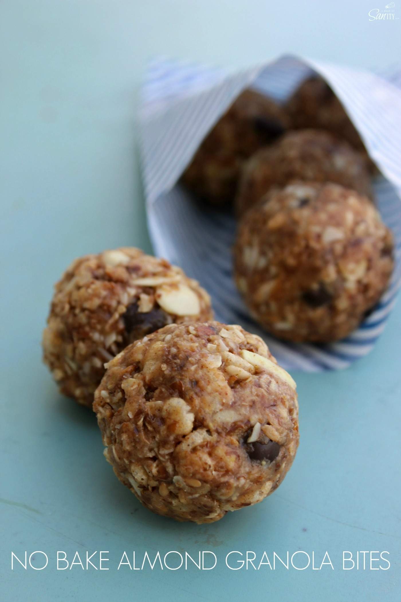 These No Bake Almond Granola Bites are made with almond butter, flaxseed, chocolate covered berries, and honey. They are a perfect snack sized bite. No Bake Almond Granola Bites
