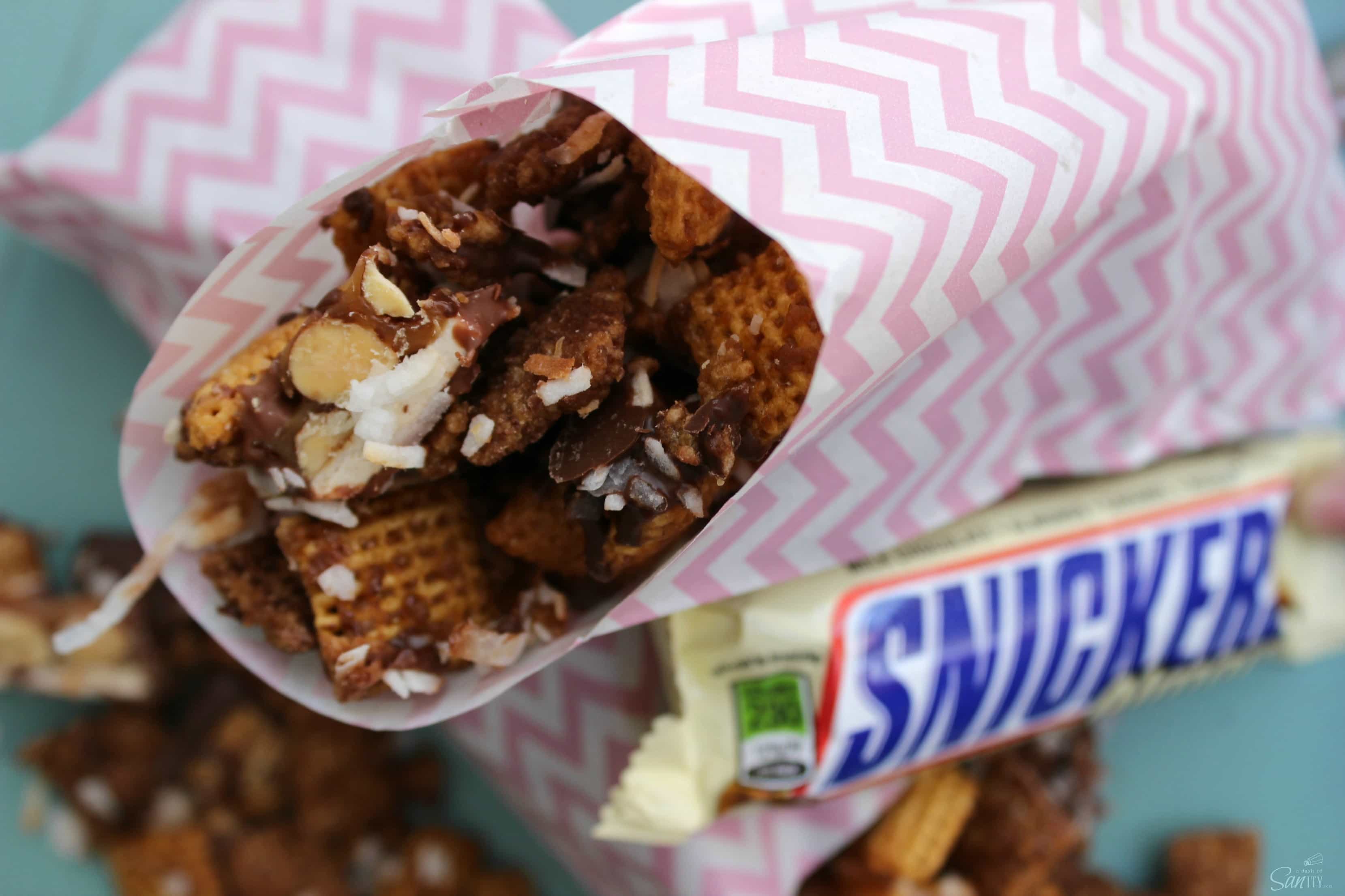 This Sweet & Salty Caramel Snack Mix is made with caramel, SNICKERS®, toasted coconut, chocolate & more caramel. This snack is seriously addicting. This Sweet & Salty Caramel Snack Mix is made with caramel, SNICKERS®, toasted coconut, chocolate & more caramel. This snack is seriously addicting.