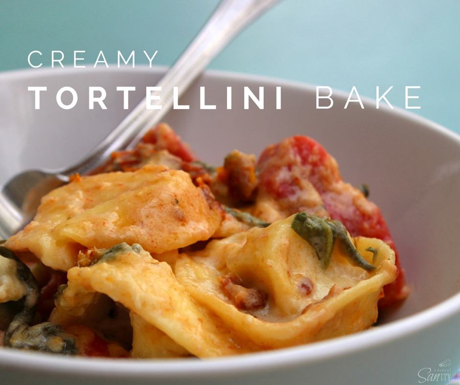 This easy to make Creamy Tortellini Bake is made with five-cheese tortellini, spinach, and light Alfredo sauce with a hint of bacon and sun-dried tomatoes.