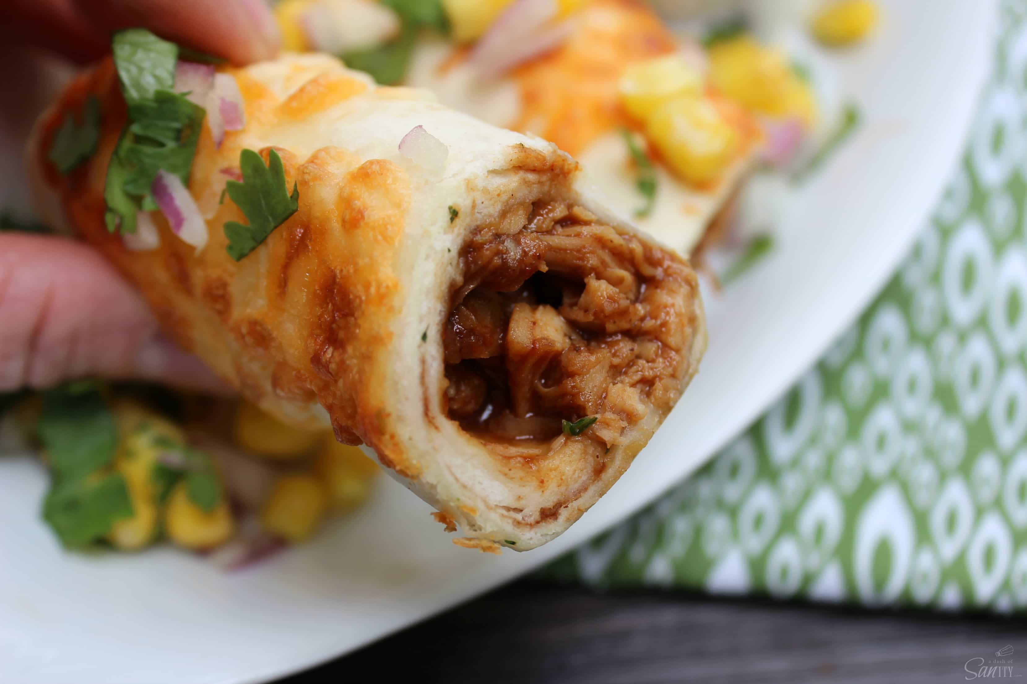 These Slow Cooker Barbecue Chicken Taquitos made with sweet barbecue chicken, rolled up in a baked taquito, and then topped with classic barbecue sides. These Slow Cooker Barbecue Chicken Taquitos made with sweet barbecue chicken, rolled up in a baked taquito, and then topped with classic barbecue sides.