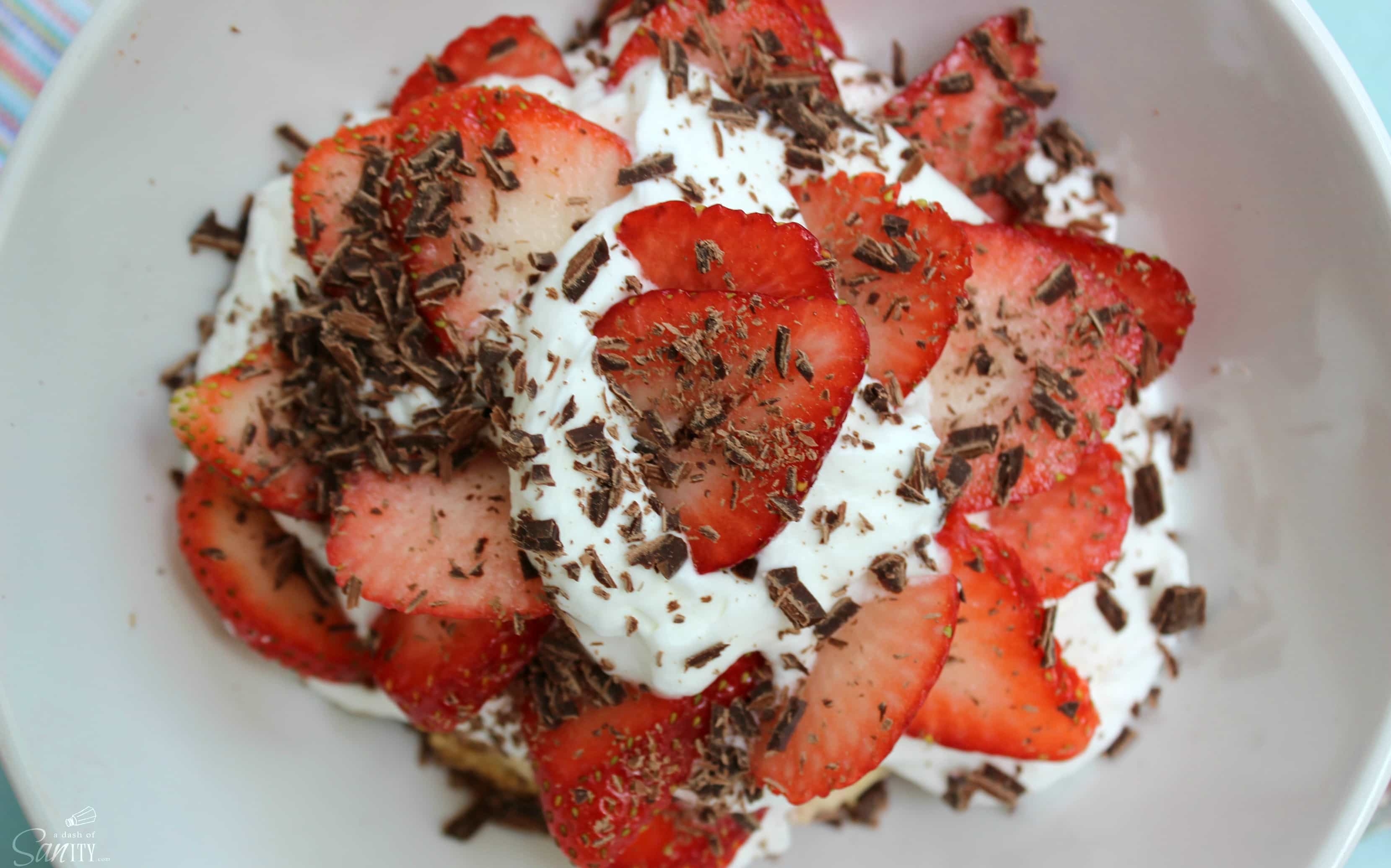 Strawberry & Rhubarb Chocolate Chip Shortcakes is a homemade rhubarb & chocolate chip biscuit, with fresh strawberries, whipped cream, & chocolate shavings. Strawberry & Rhubarb Chocolate Chip Shortcakes is a homemade rhubarb & chocolate chip biscuit, with fresh strawberries, whipped cream, & chocolate shavings.