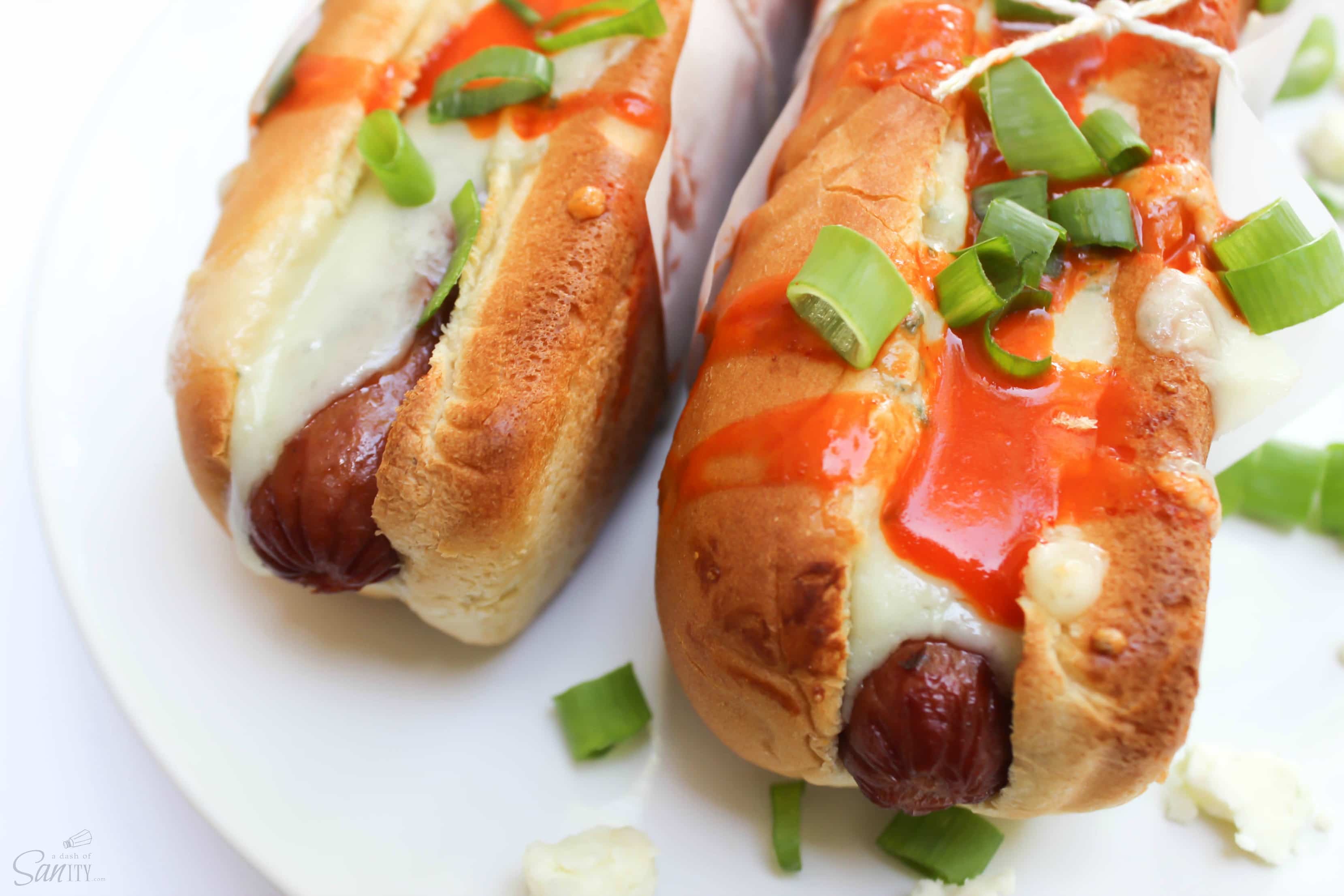 Fire up the grill for these Buffalo Wing Hot Dogs. They are a food collision of your two summer party favorites: hot dogs and buffalo wild wings.