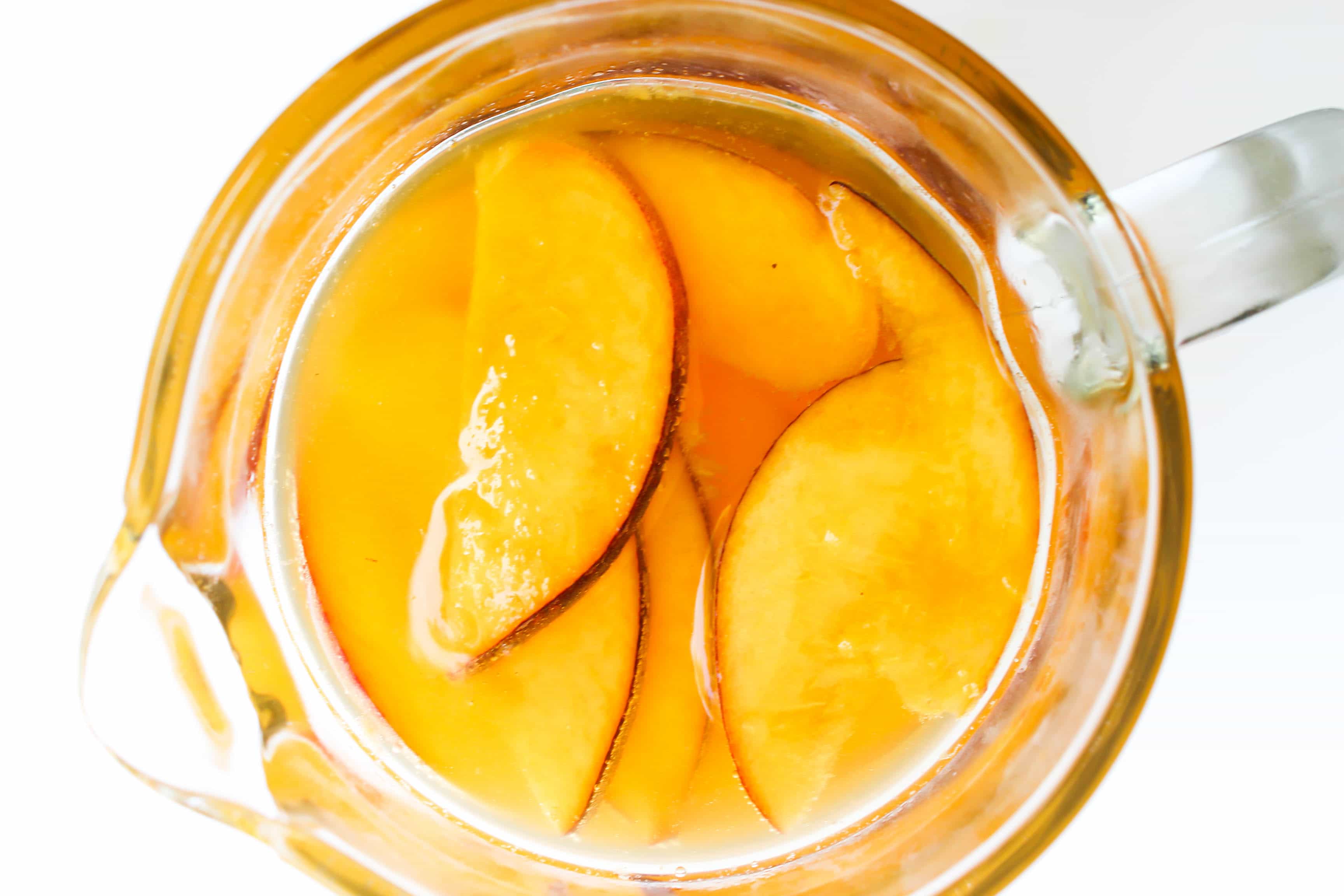 This Sparkling Peach Cider is a gorgeous summer drink to toast to late summer nights, days at the pool, and time spent with family & friend. This Sparkling Peach Cider is a gorgeous summer drink to toast to late summer nights, days at the pool, and time spent with family & friend.