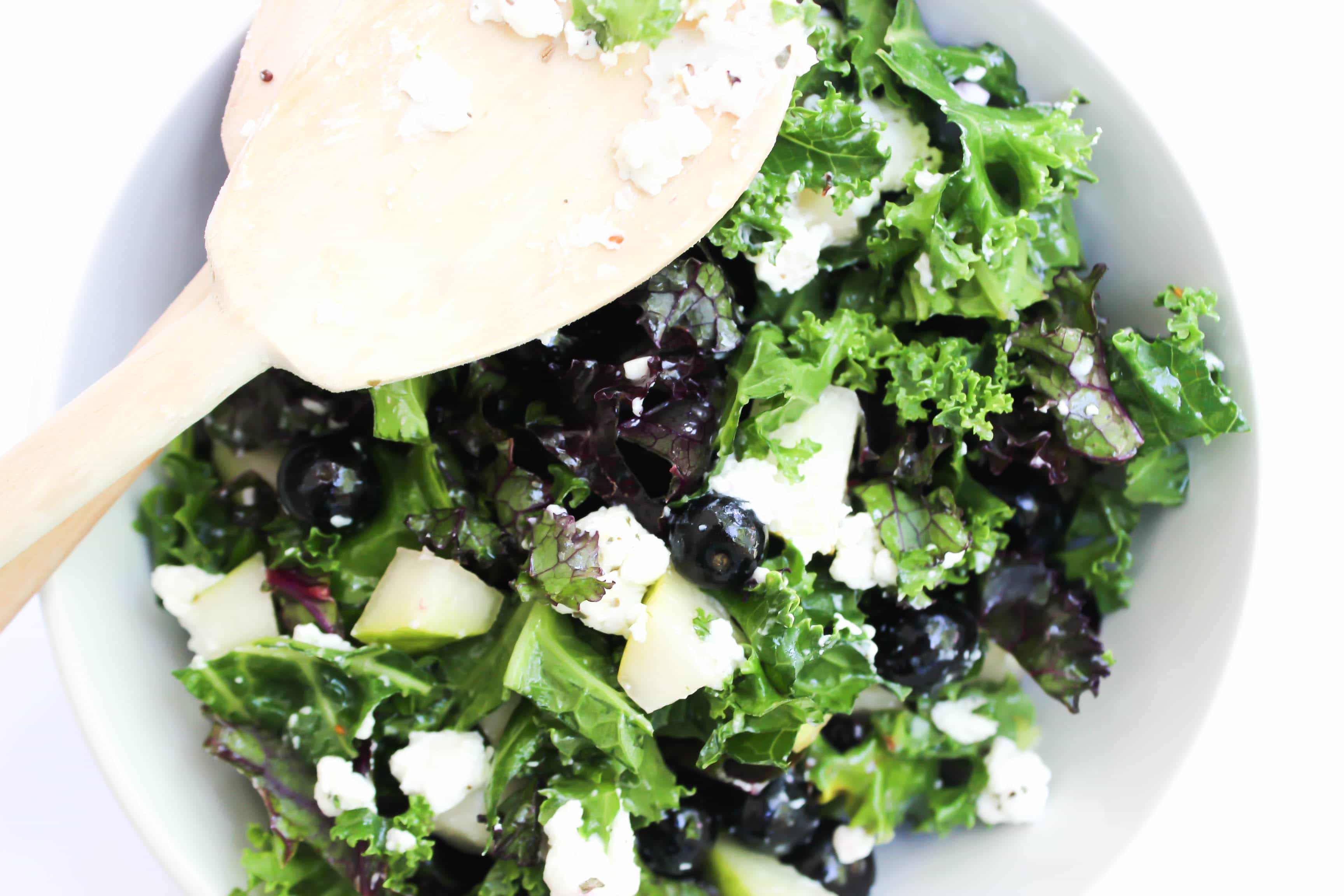 This healthy Power Kale Salad is made with two different kinds of kale, blueberries, pears, goat cheese, and pecans, drenched in a sweet lemon dressing. 