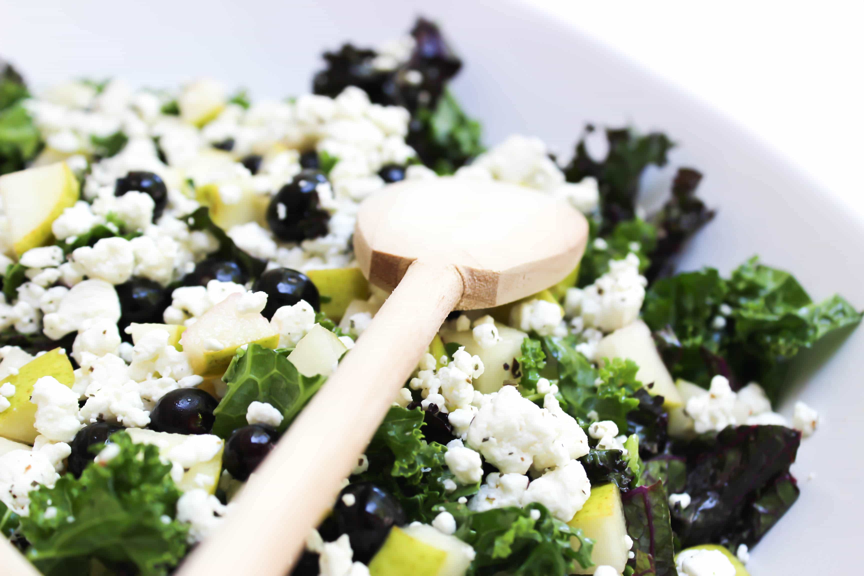 This healthy Power Kale Salad is made with two different kinds of kale, blueberries, pears, goat cheese, and pecans, drenched in a sweet lemon dressing. 