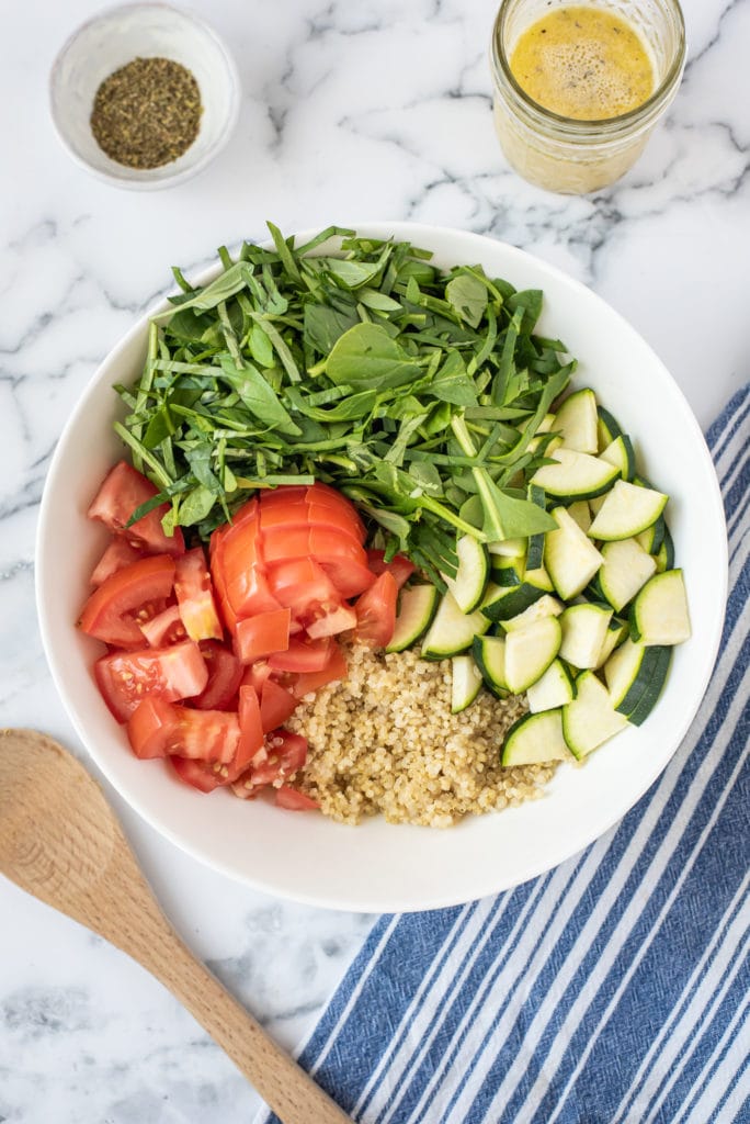 overhead photo of the salad ingredients being combined
